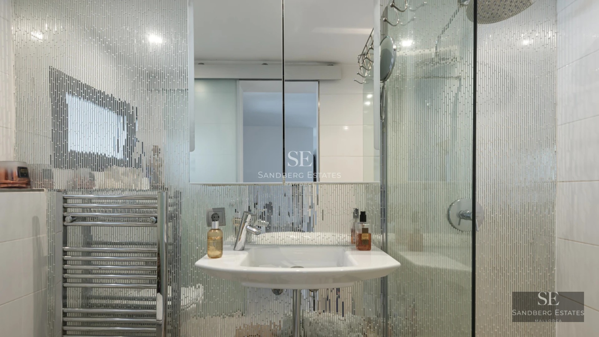 Exterior view of a modern villa featuring a pool, expansive terraces, lush vegetation and contemporary architecture.