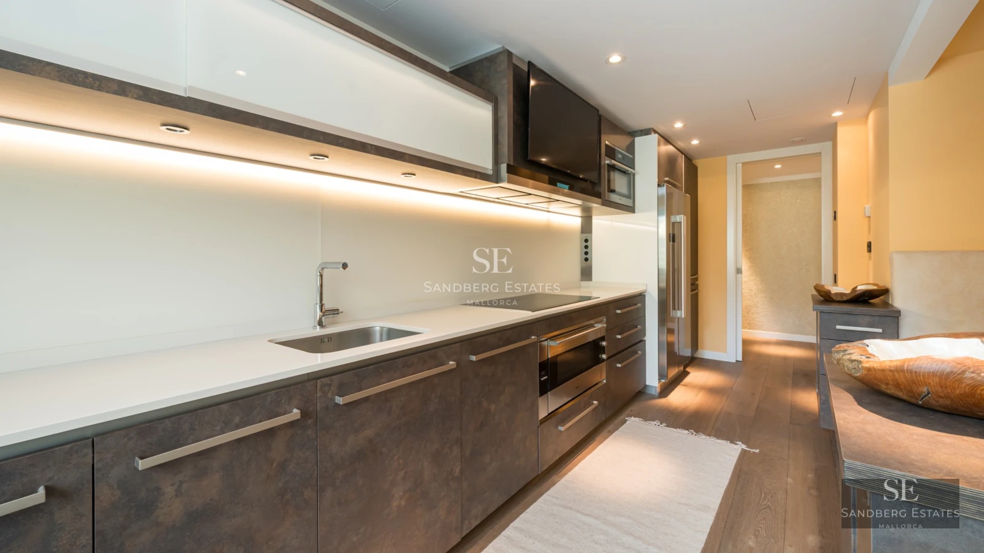 Exterior view of a modern villa featuring a swimming pool, garden, and large windows. Minimalist architecture with high-quality finishes.