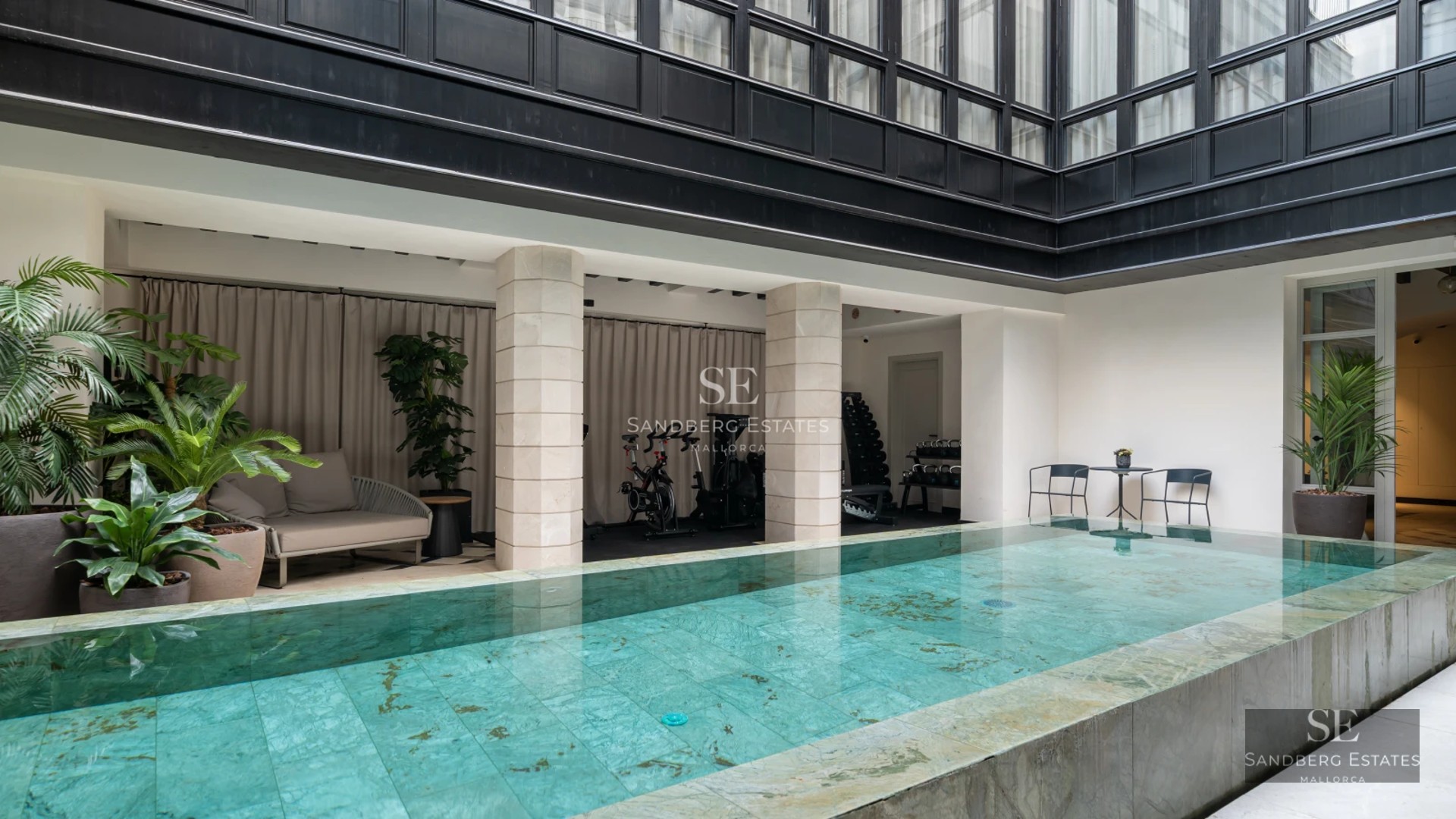 Exterior of modern villa with pool, large windows and minimalist architectural design. Lush garden and terrace.