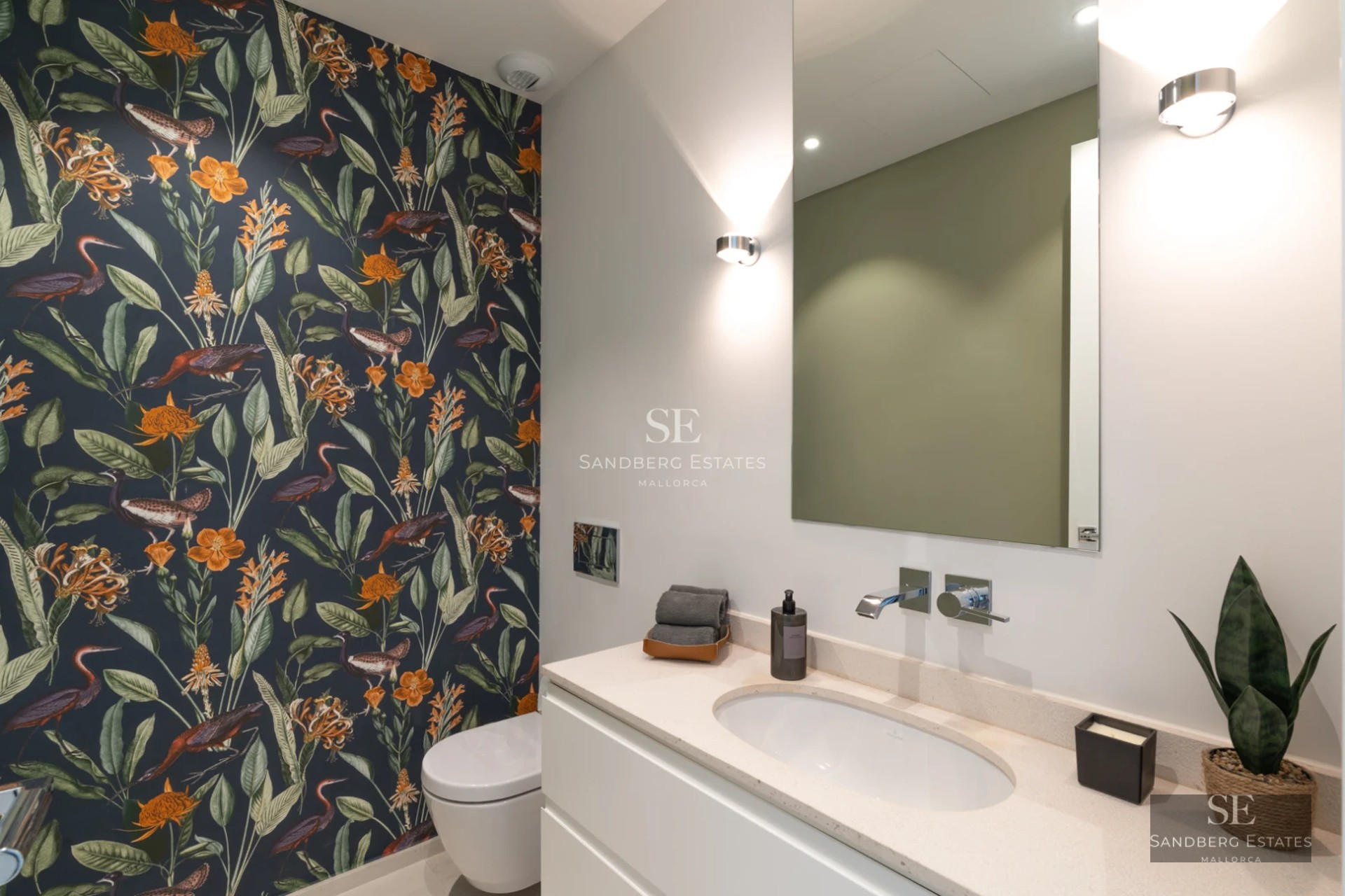 Infinity pool view with lawn, sun loungers and panoramic views. Sleek modern architecture with large windows.