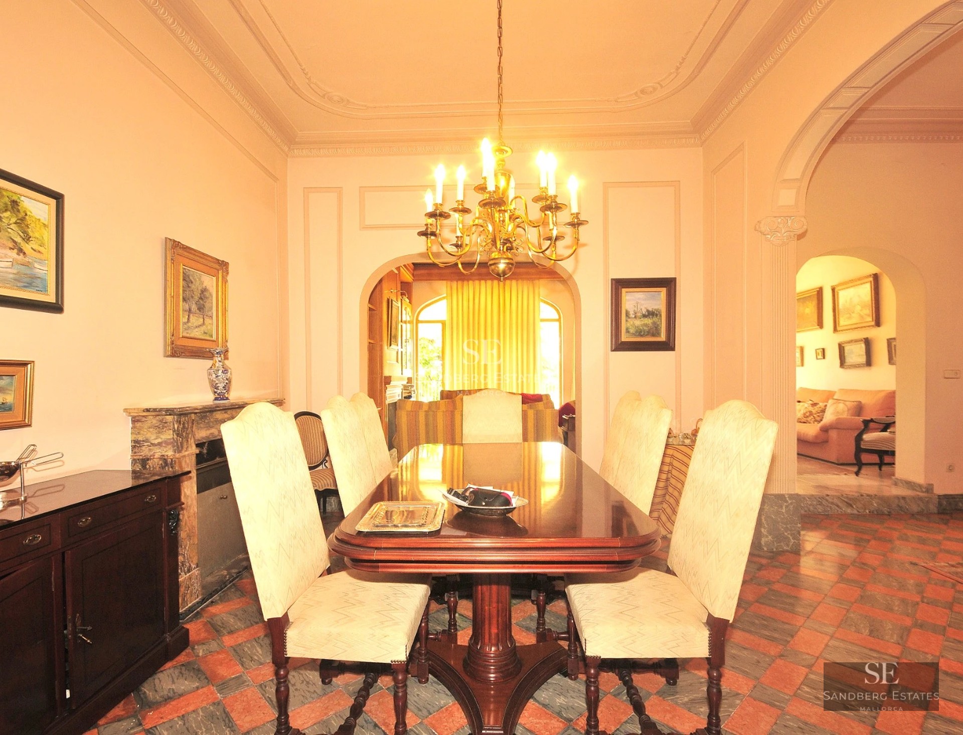 Exterior view of a modern villa featuring an infinity pool, wooden deck, large glass windows, and lush garden. Minimalist architecture.