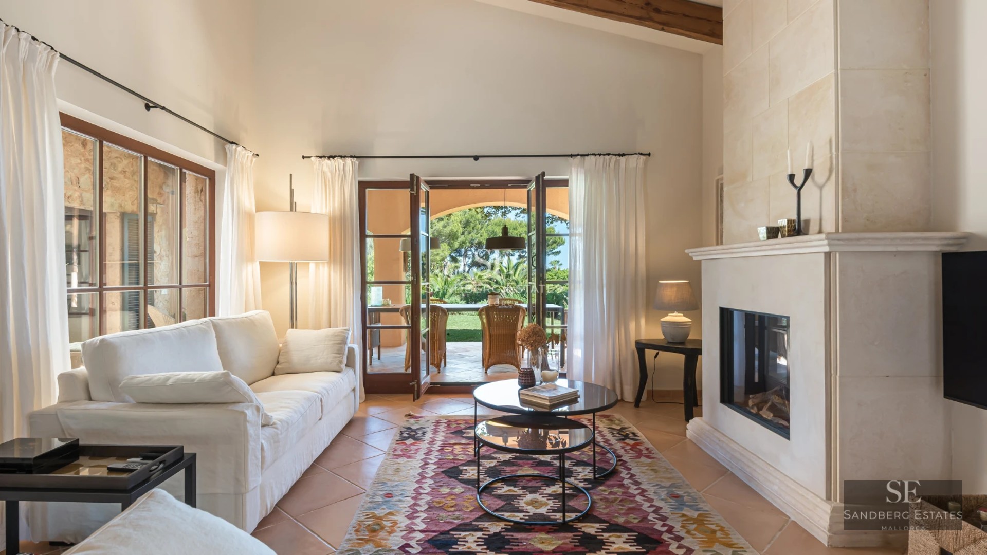 Spacious outdoor area featuring a modern pool, seating area, lush greenery, and elegant architectural design. Natural lighting.