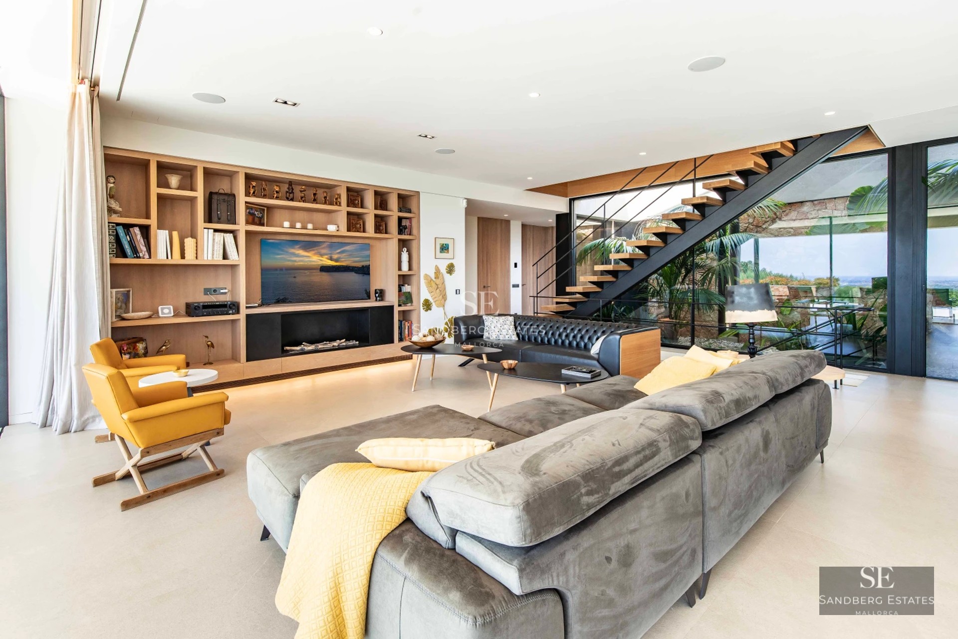 Spacious balcony with sea view, glass railing, modern outdoor furniture. Minimalist design, natural light.