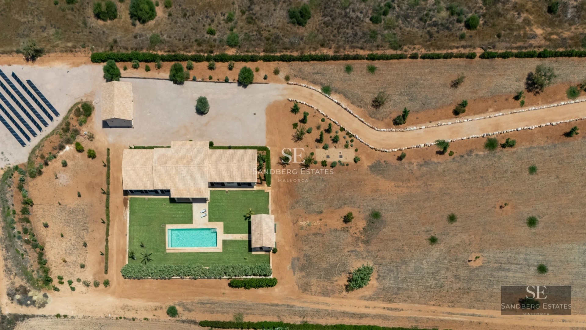 Stunning infinity pool with panoramic sea views. Modern design, expansive terrace, and lush landscaping.