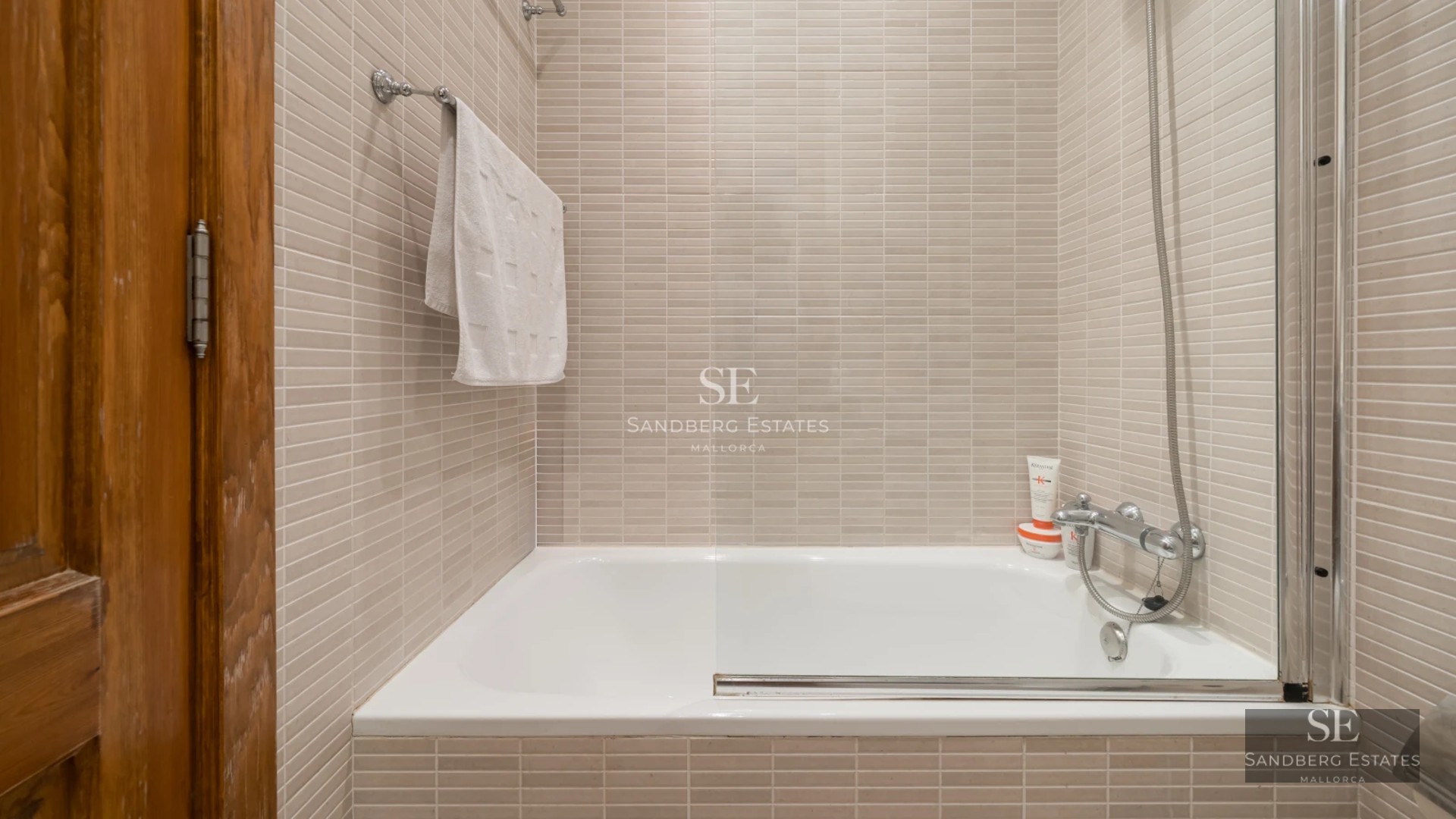 Exterior view of modern villa with infinity pool, lush garden, and minimalist architectural design.