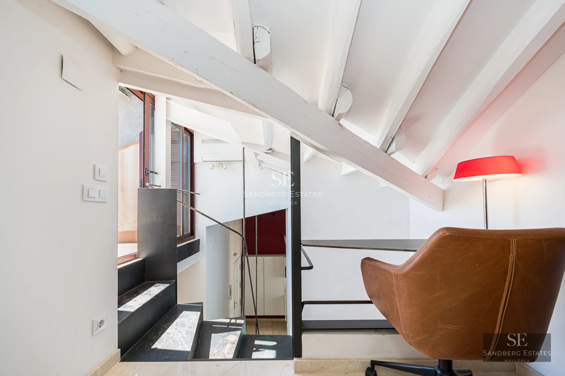 Spacious balcony with sea view. Modern and elegant furniture. Glass railing offering unobstructed view.