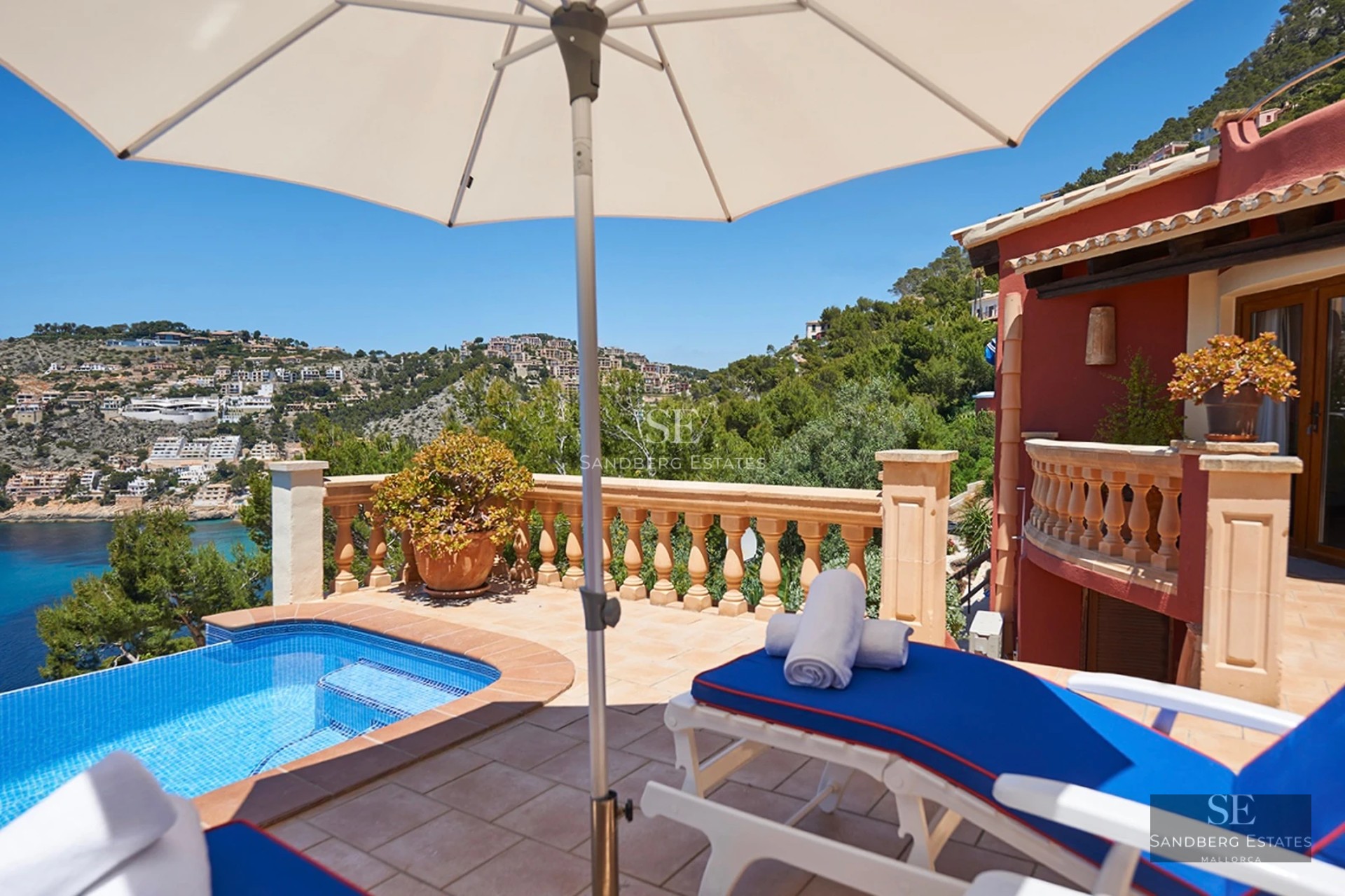 Spacious terrace with pool, sun loungers, and panoramic views. Modern design with high-quality finishes and abundant natural light.