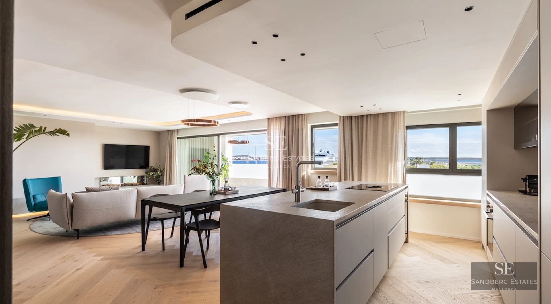 Infinity pool view with vanishing edge, surrounded by lush greenery. Modern design with ambient lighting.