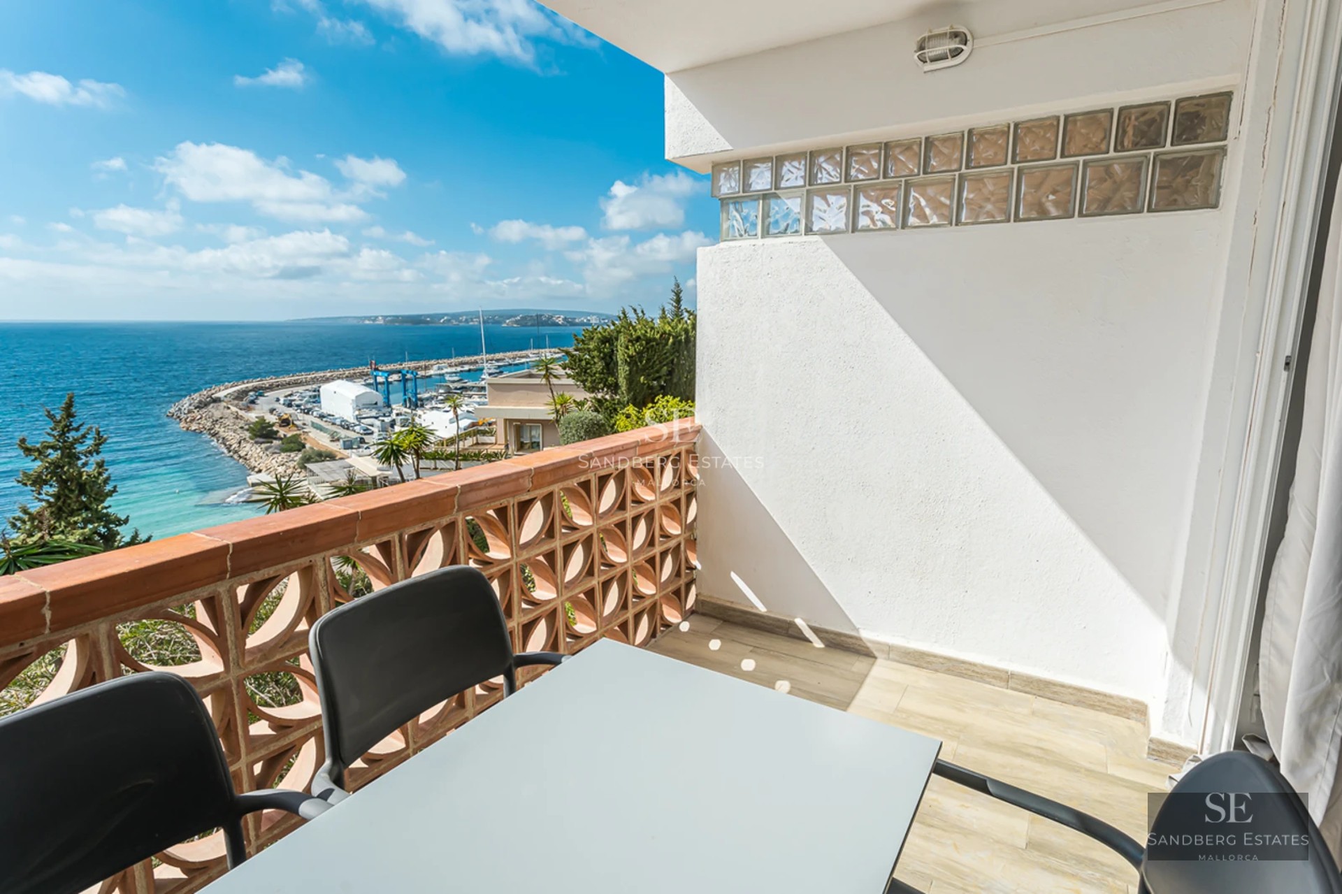 Spacious living room with panoramic views. Minimalist interior, abundant natural light, modern fireplace, and designer furniture.