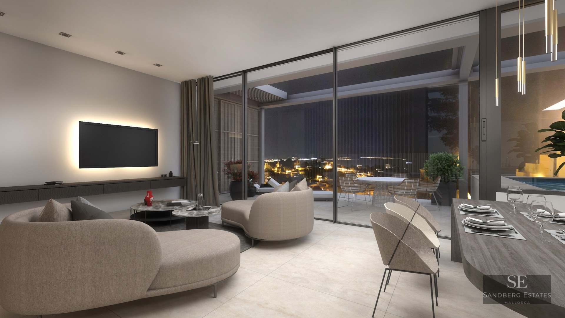 Luxury living room with beige sofas, large glass doors, and a terrace overlooking city lights at night.