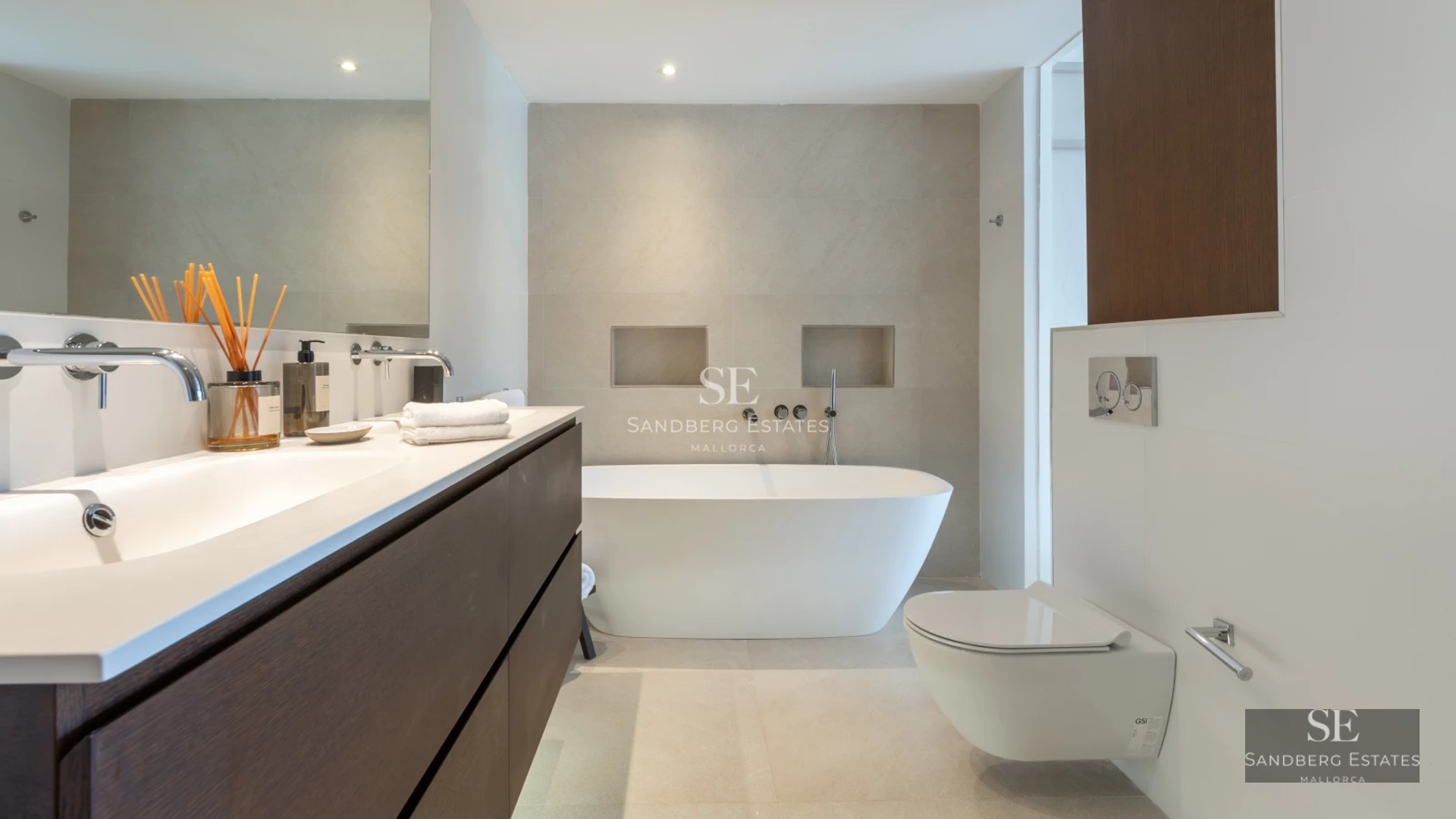 View of a luxury villa with infinity pool, spacious terrace and panoramic sea views. Modern architecture, elegant design.