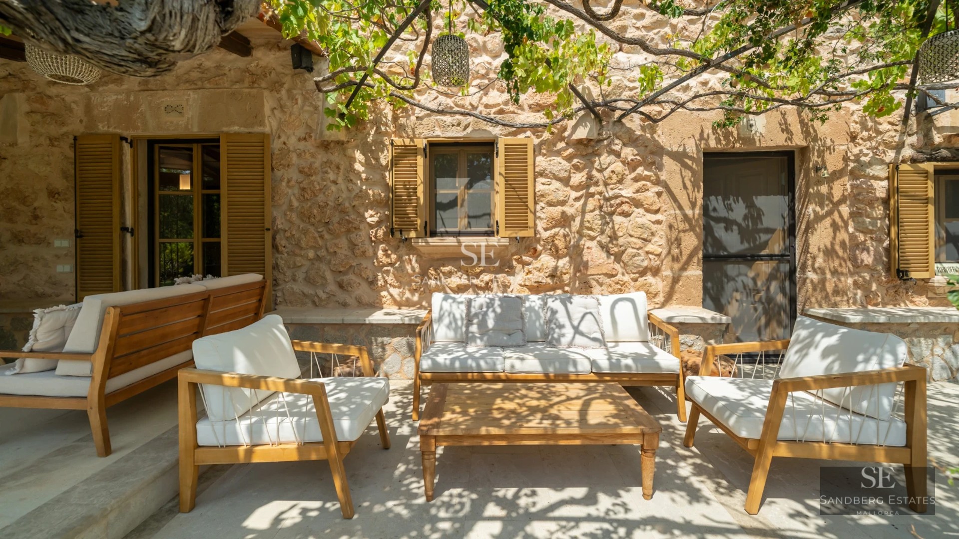 Exterior view of a luxurious modern villa with infinity pool, expansive terraces, and lush gardens. Minimalist architecture with large windows.