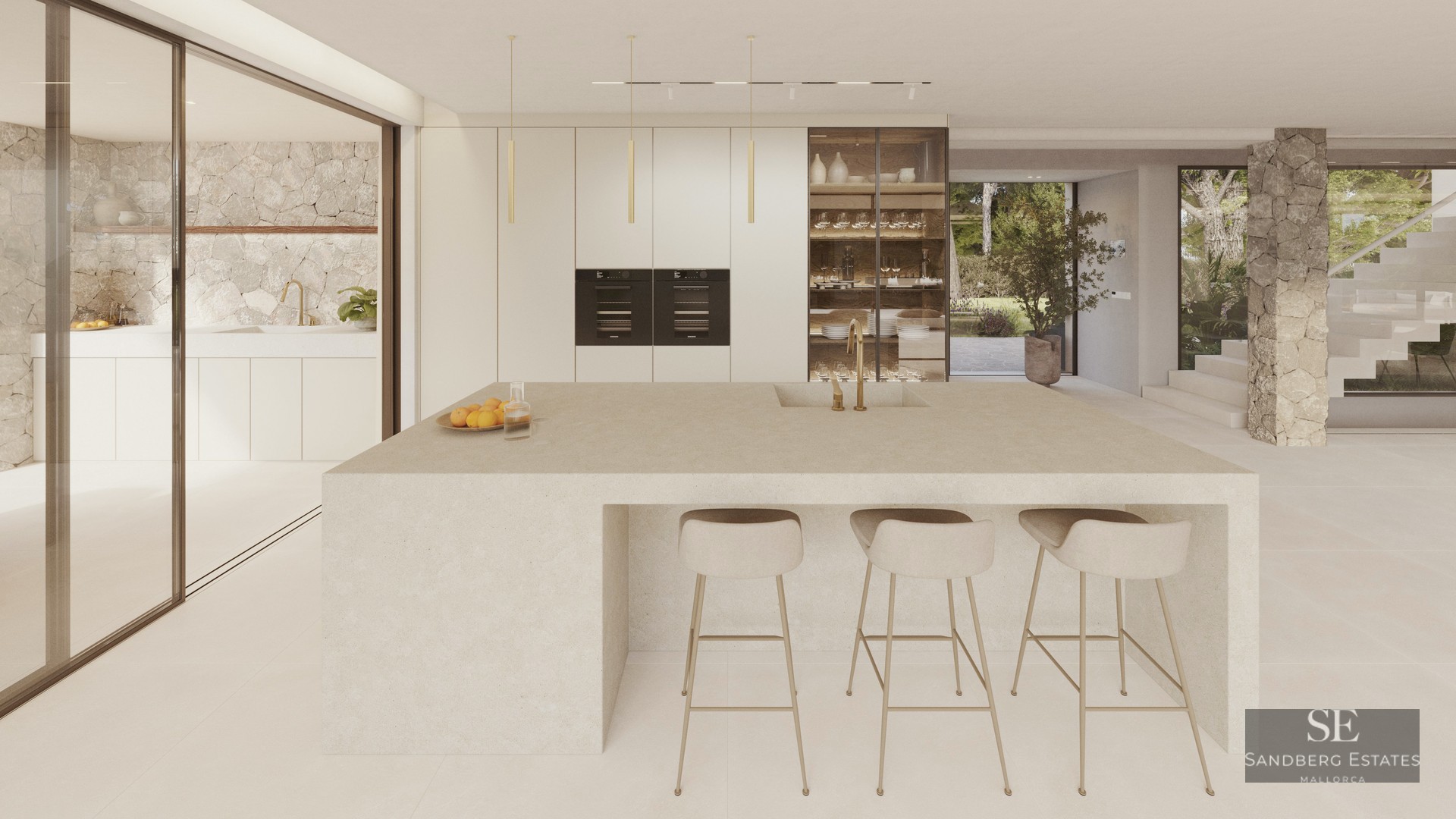 A minimalist modern kitchen featuring a large stone central island, beige bar stools, and natural stone wall accents.