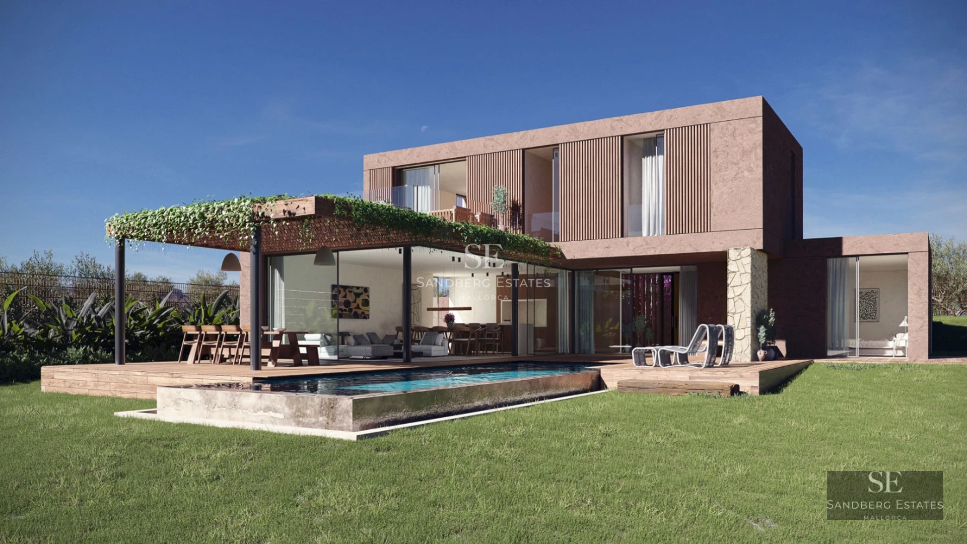 View of a modern pool surrounded by greenery and an elegant house with large windows and an inviting terrace.