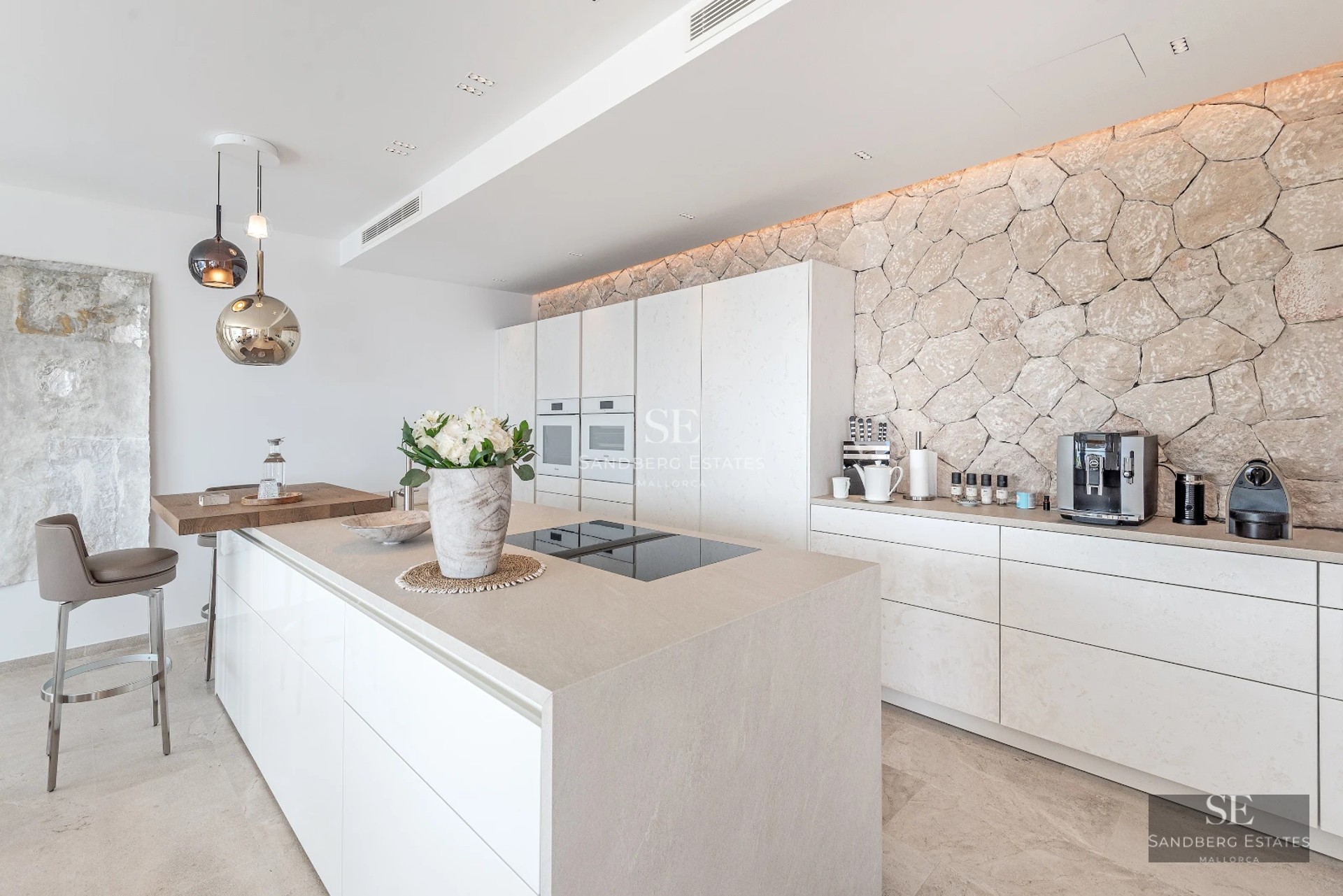 Spacious living room with large windows, outdoor pool and lush garden. Modern and bright design.