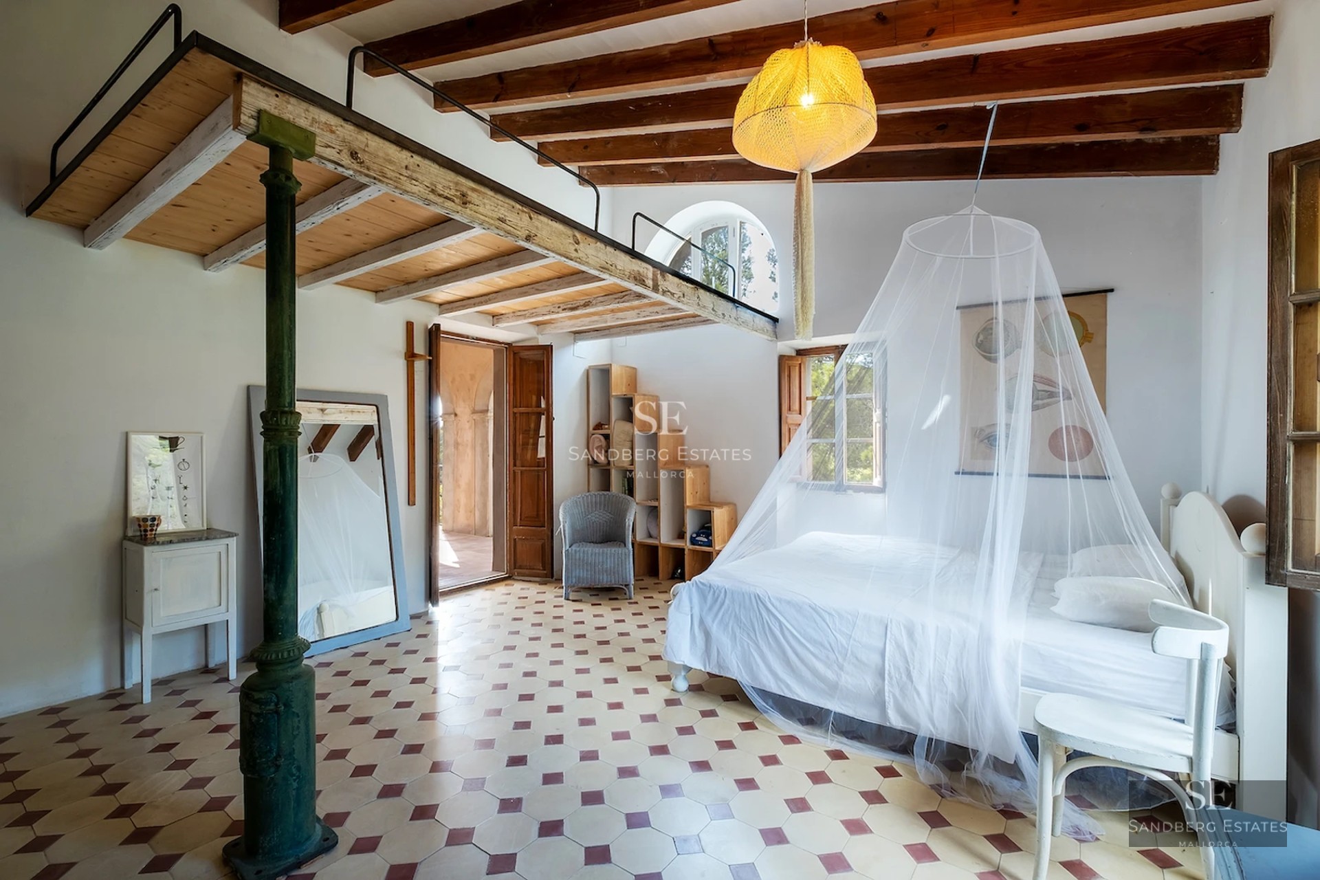 Spacious balcony with sea view, glass railing, modern furniture, and awning. Ideal space to relax and enjoy the scenery.