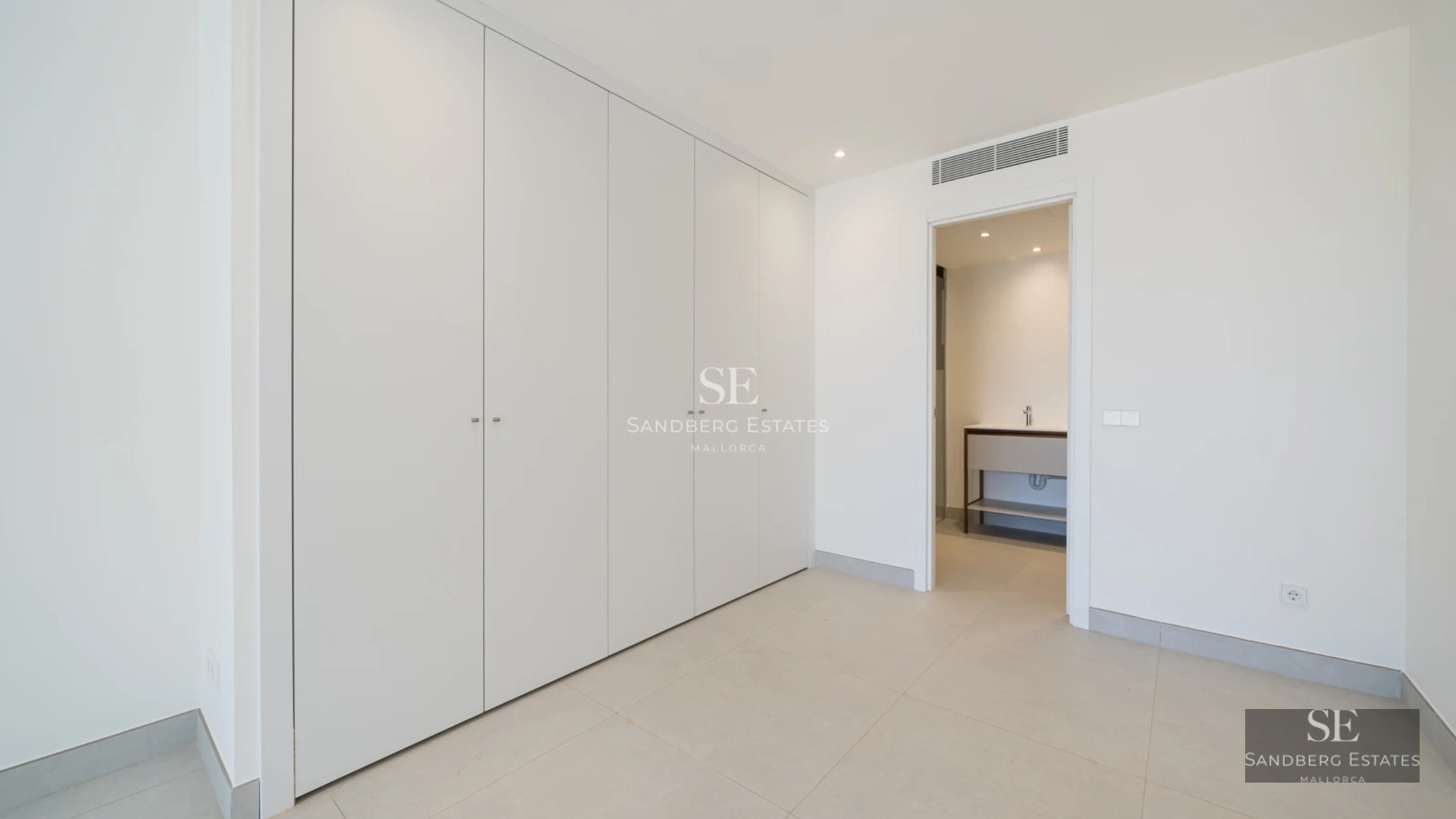 View of modern balcony with sparkling pool. Natural lighting, glass railing, and panoramic views. Minimalist design.