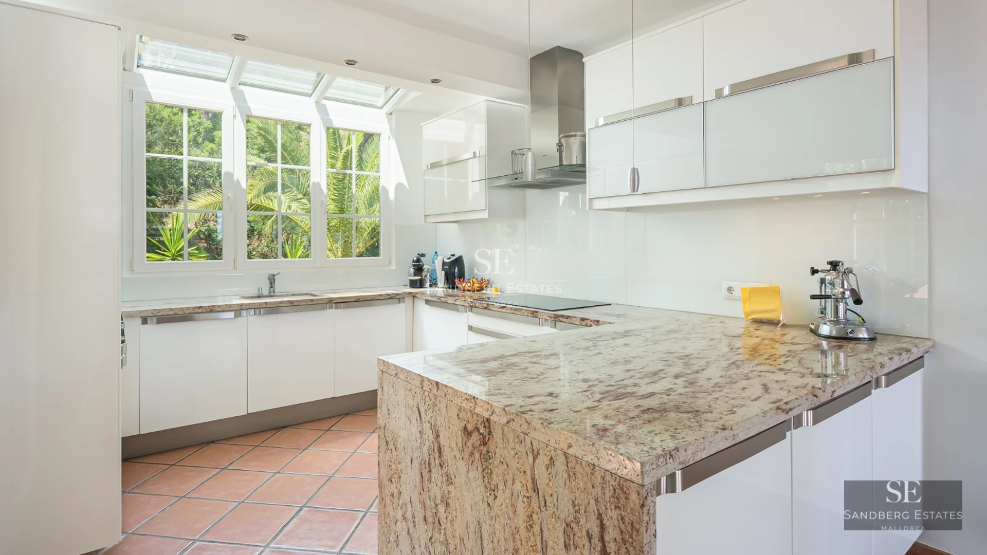 Aerial view of a modern villa with infinity pool, large garden and minimalist design with wooden accents.