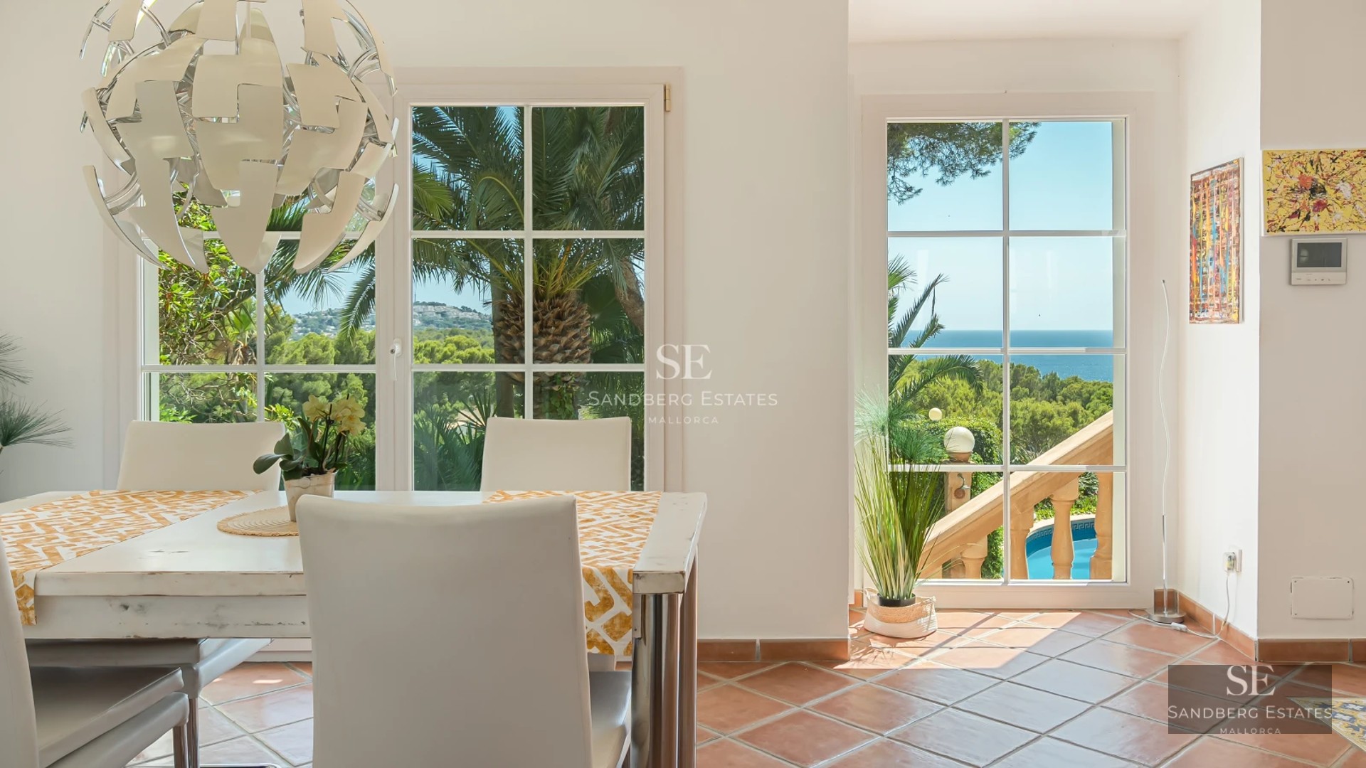Exterior view of modern villa featuring an infinity pool, expansive terraces, and lush vegetation. Contemporary architectural design.