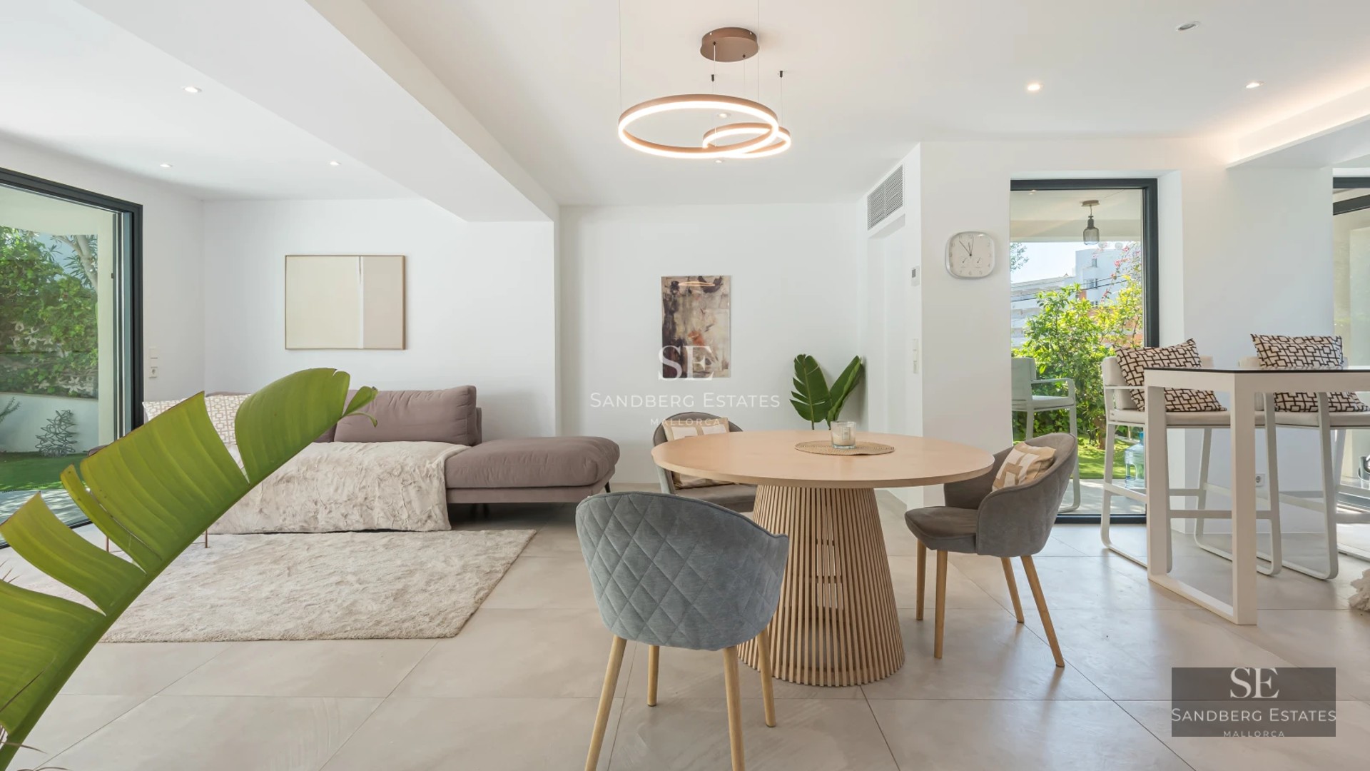 Spacious balcony with panoramic sea views. Modern and elegant furniture. Glass railing maximizing the view.