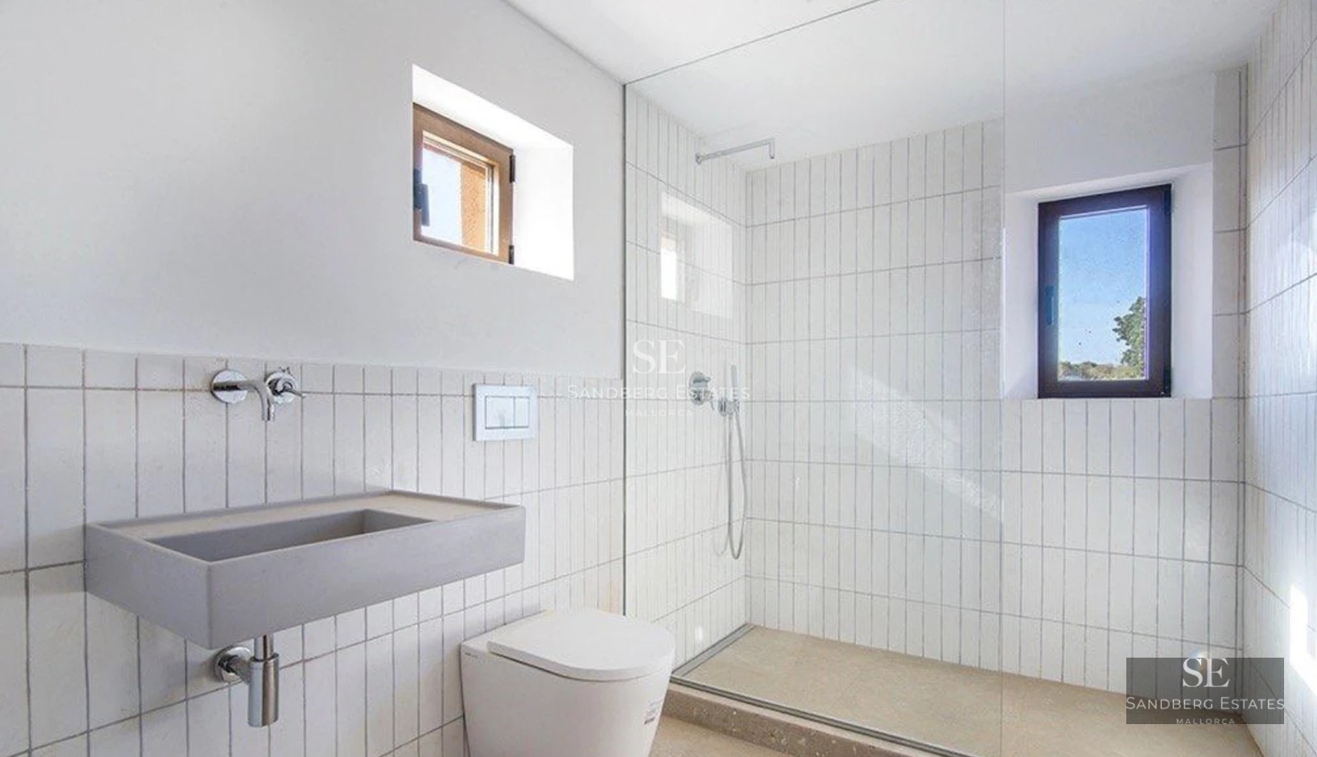 Exterior view of a modern villa with pool, lush vegetation and large windows reflecting sunlight.