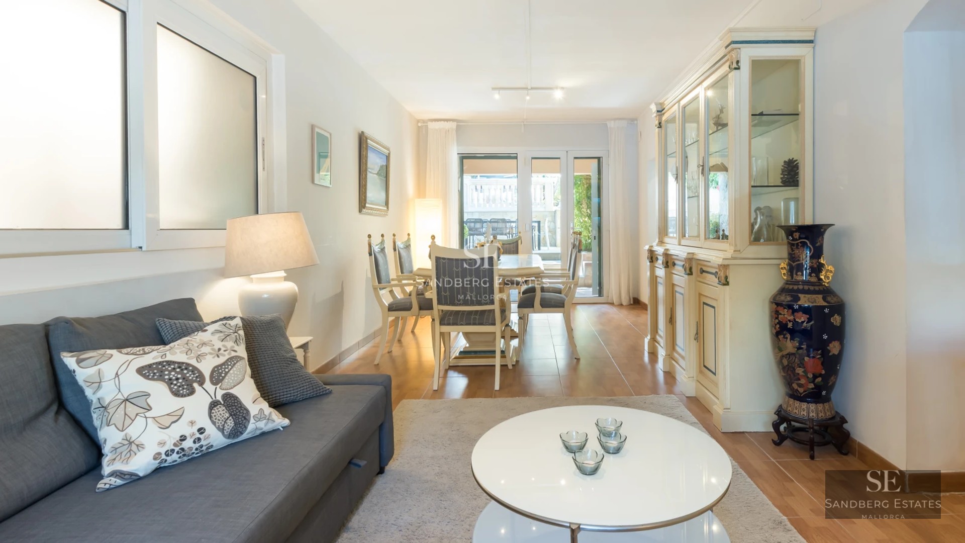 Spacious living room with balcony, panoramic sea views. Modern, bright, and elegant design. High-quality furniture, neutral color palette.