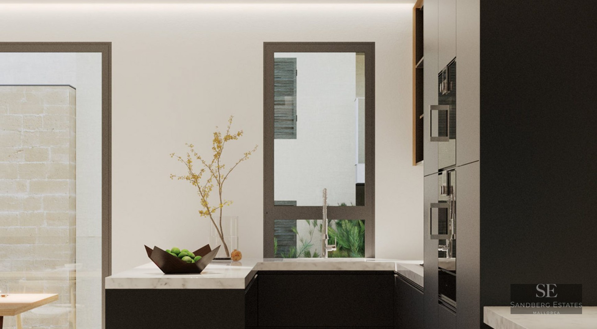 Modern kitchen with black cabinets, white marble countertop, and large windows overlooking a courtyard.