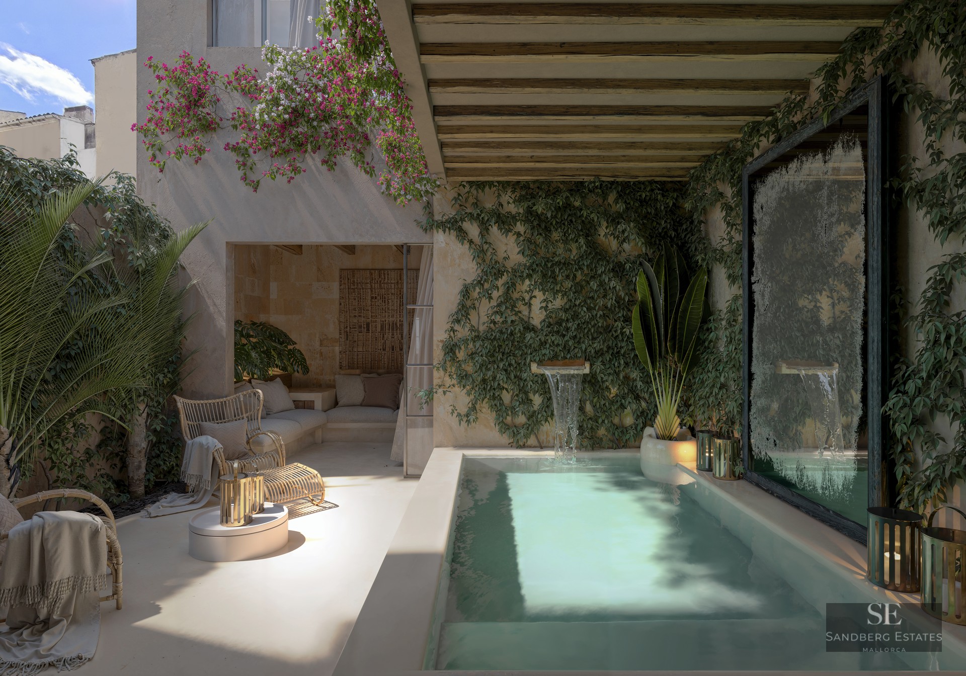 Private plunge pool with waterfall feature surrounded by ivy walls, bougainvillea, and wicker seating under a pergola.