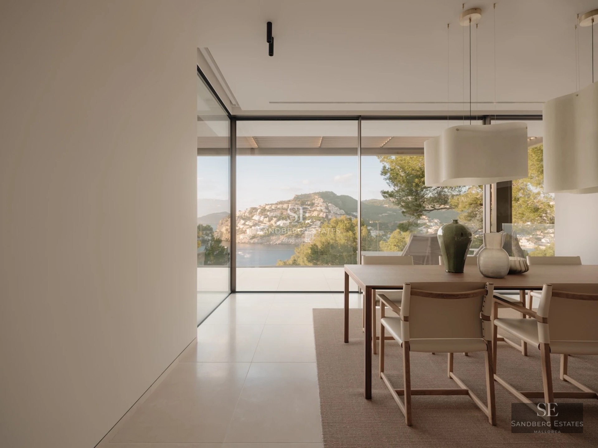 Spacious terrace with infinity pool and panoramic views. Modern design with elegant furniture and touches of greenery.