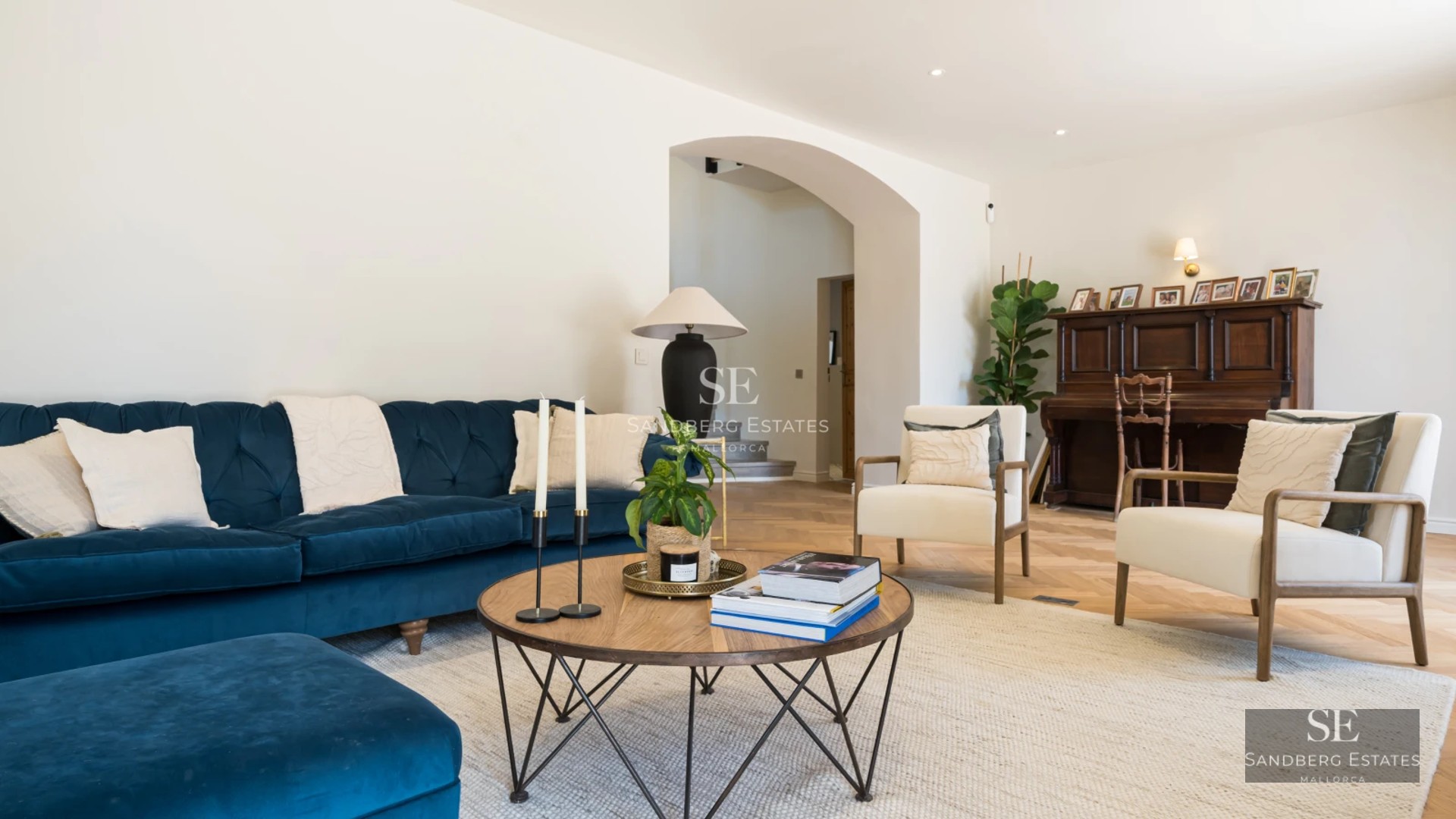 Spacious living room with large windows and panoramic sea views. Modern and bright design with balcony. Designer furniture.