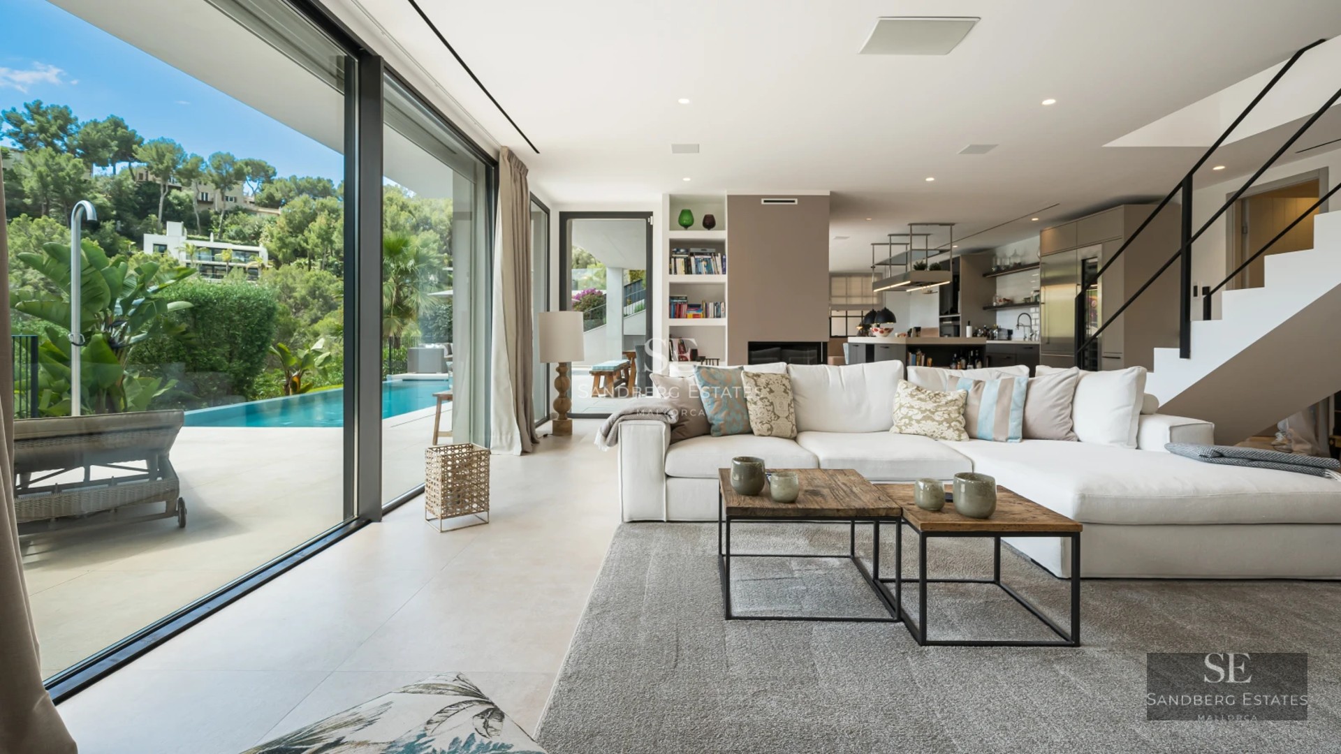 Luxurious exterior view with reflecting pool, modern architecture, and expansive green space. Sophisticated design, ambient lighting.