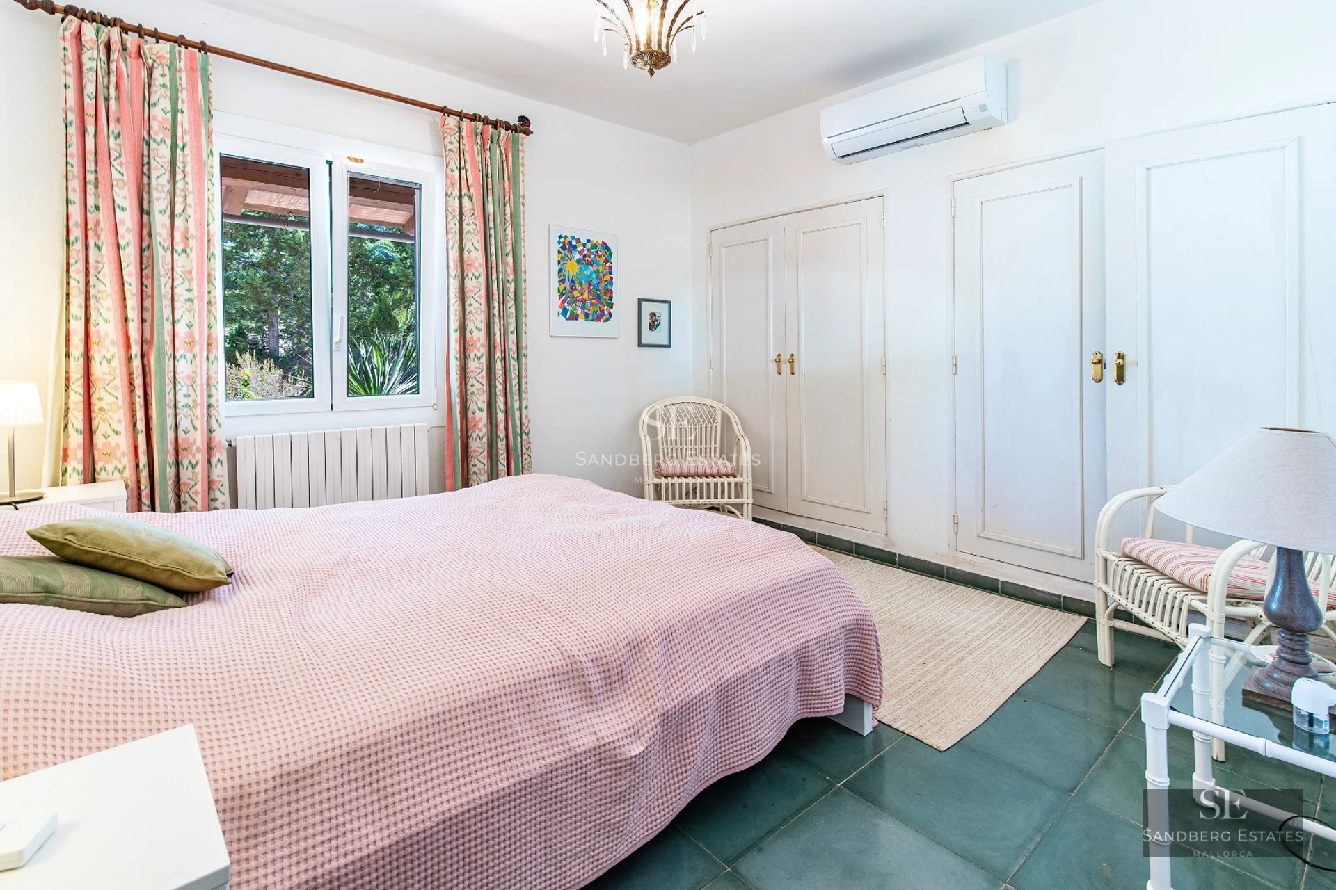 Exterior view of a modern villa featuring an infinity pool, expansive windows, elegant landscaping, and minimalist architecture.