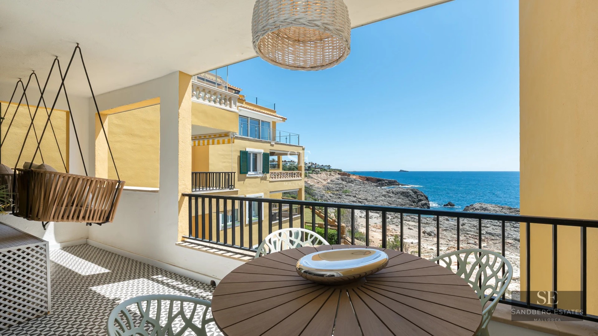 Exterior view of a modern villa with an infinity pool, large windows, and lush vegetation. Contemporary architecture and avant-garde design.