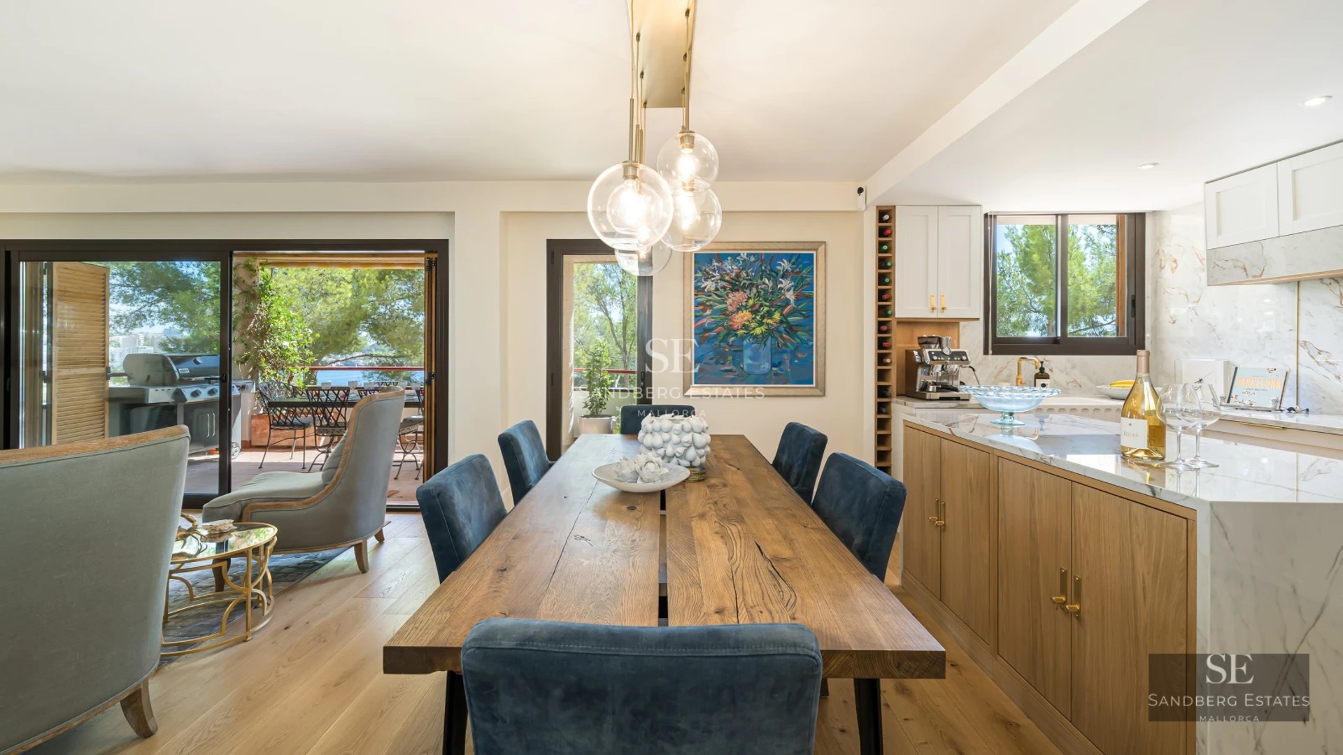 Spacious terrace with infinity pool, sun loungers, panoramic view, and modern architecture. Luxurious outdoor spaces for relaxation.