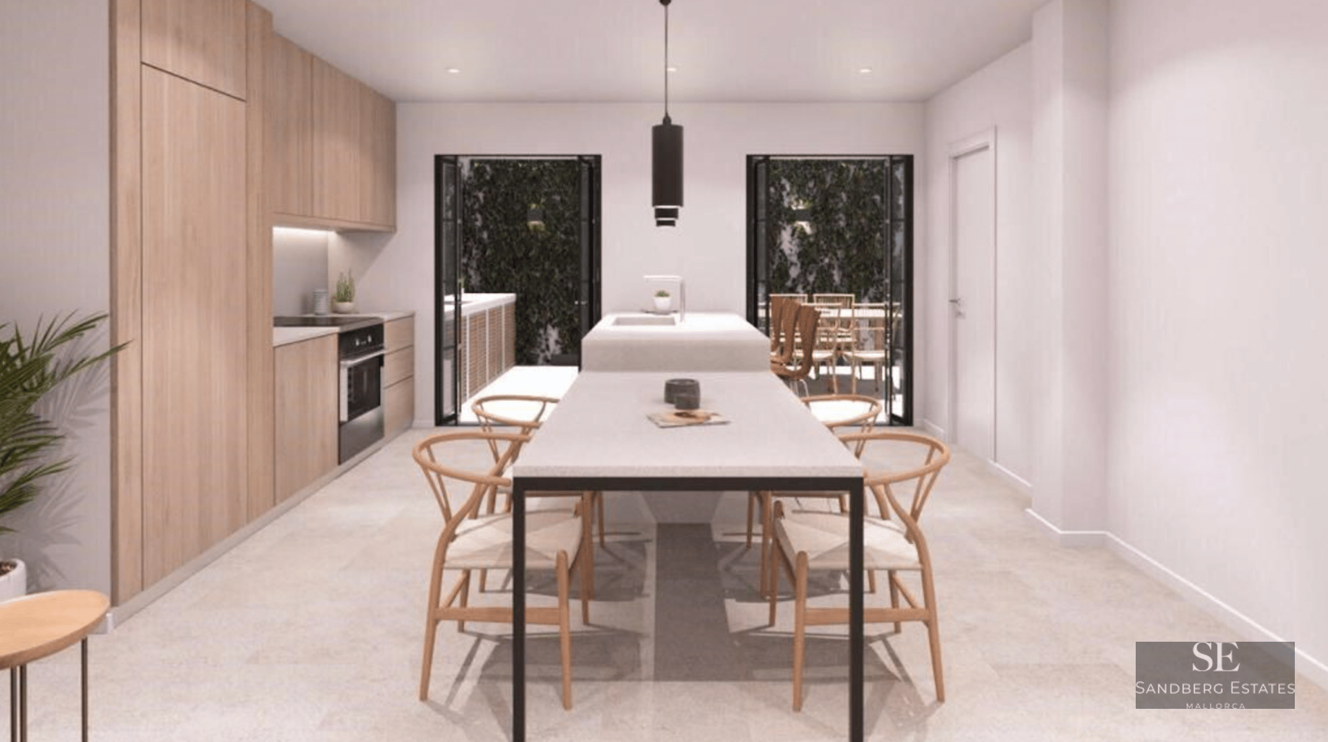 Modern kitchen with light wood cabinets, white central island, and integrated dining table with wooden chairs.