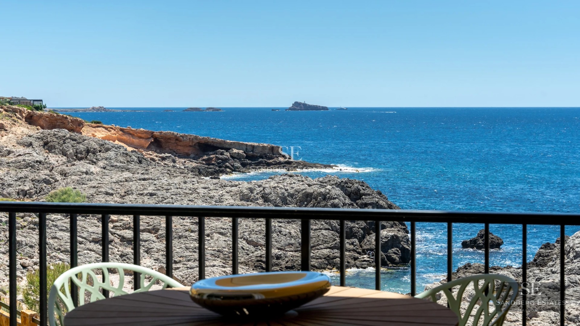 View of a luxurious villa with a pool, surrounded by greenery. Modern design, large windows, and high-quality finishes.