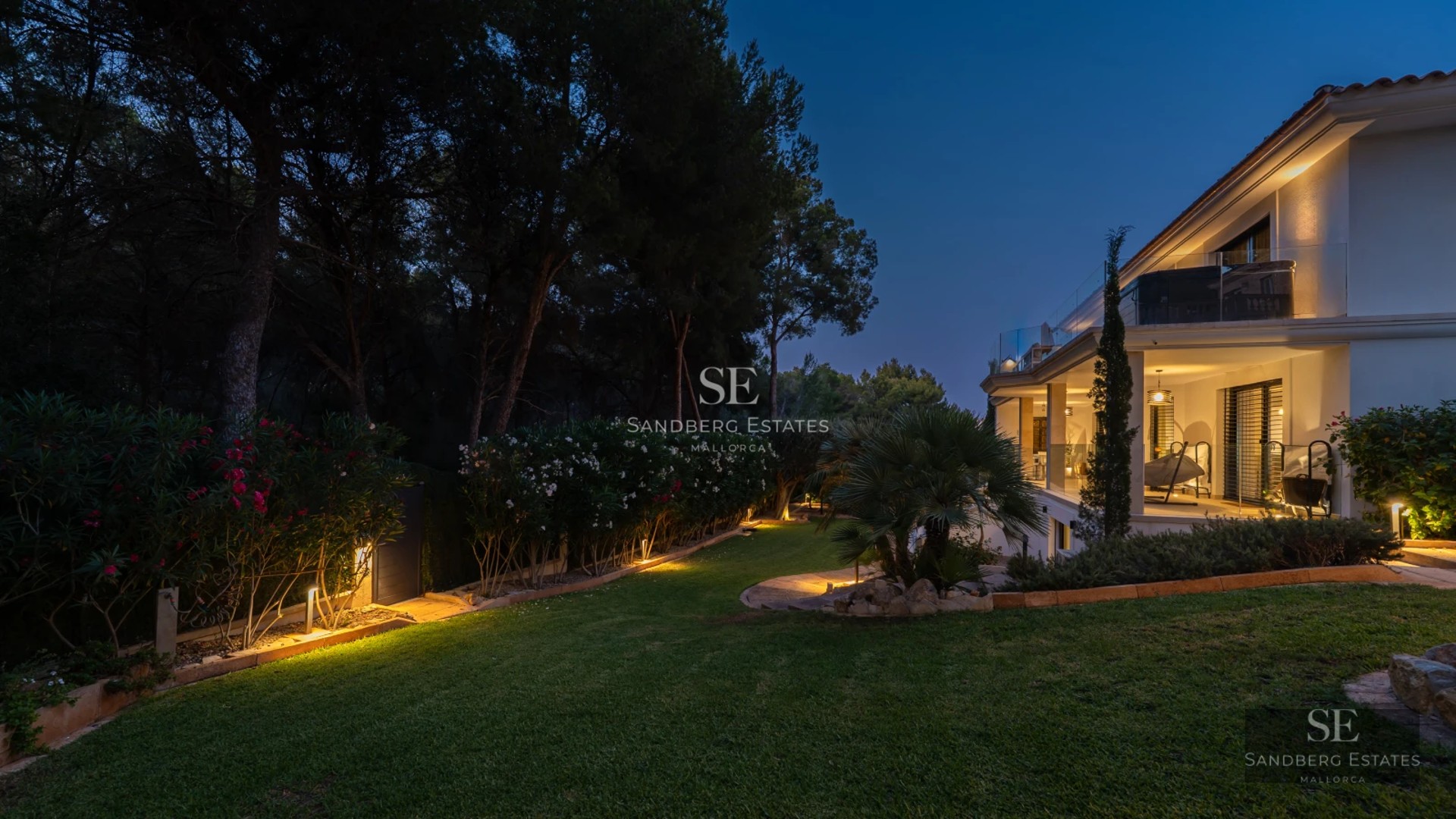 Spacious terrace with infinity pool. Panoramic views. Modern designer furniture. Warm ambient lighting.