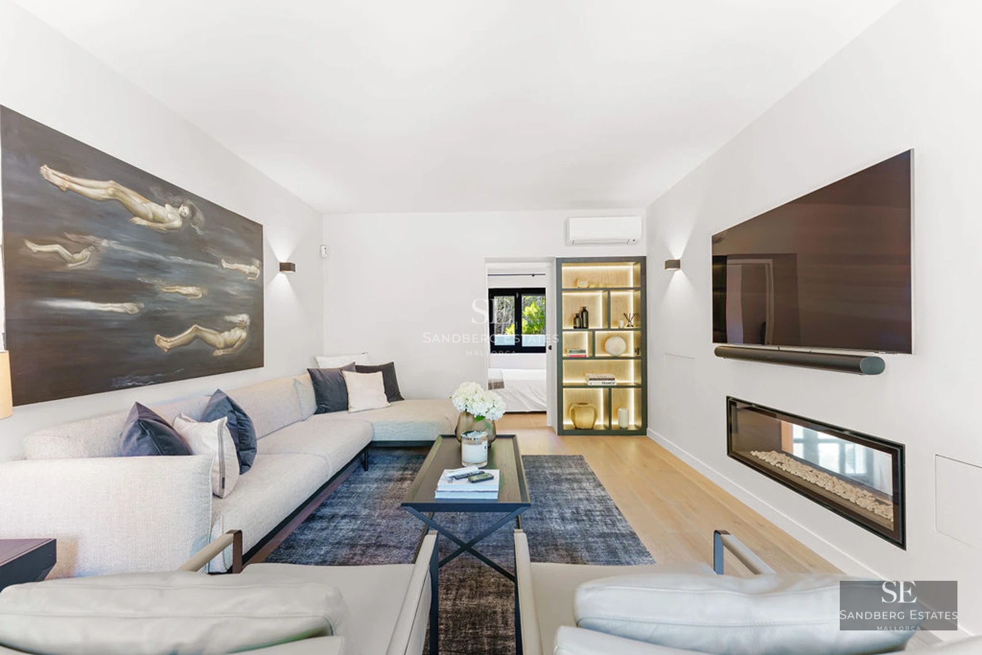 Expansive terrace featuring an infinity pool with ocean views. Lush garden with sun loungers and seating area. Modern and elegant design.