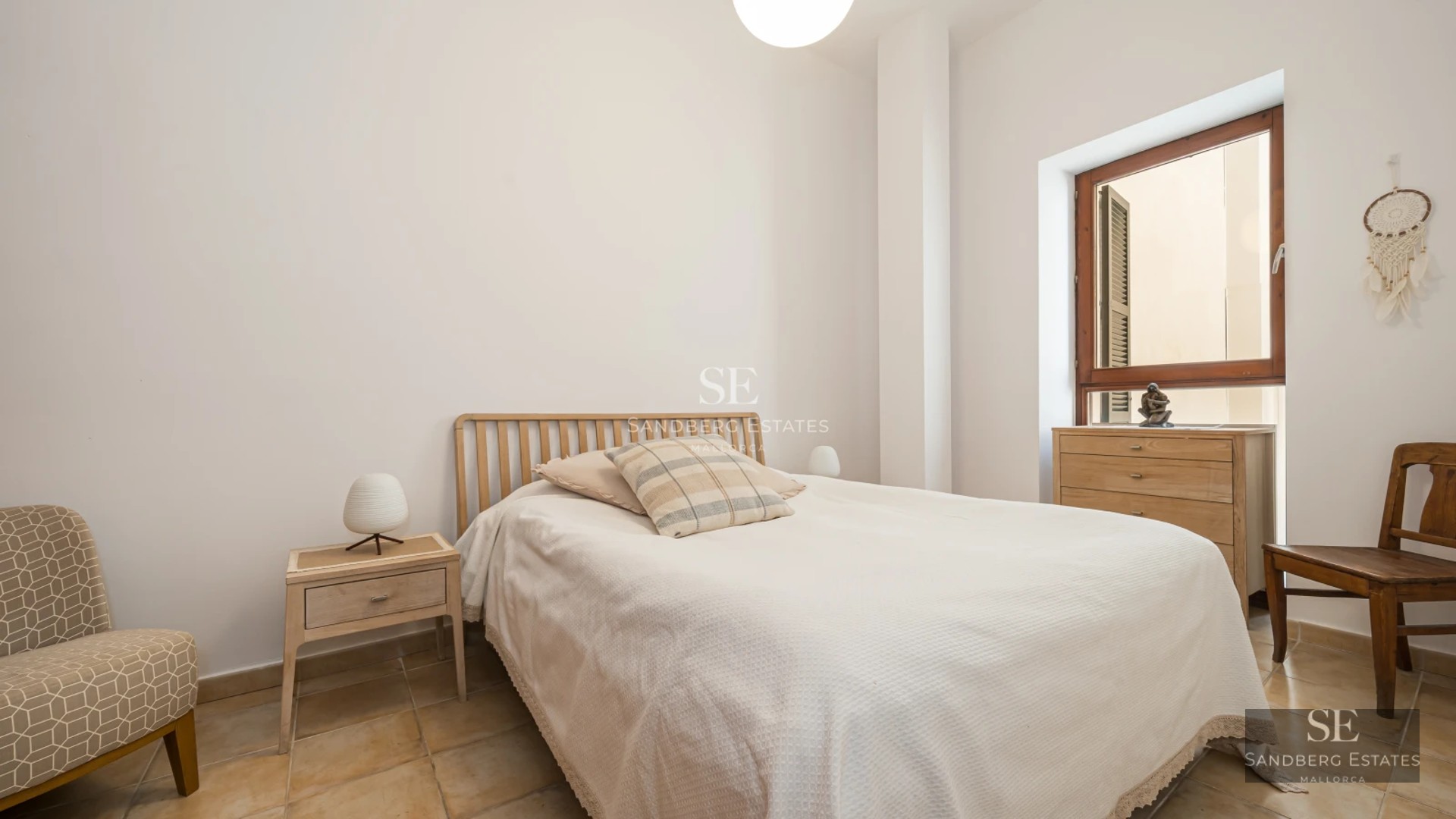 Exterior view of a modern house featuring a reflective pool, lush garden, and spacious patio. Sleek and contemporary architectural design.