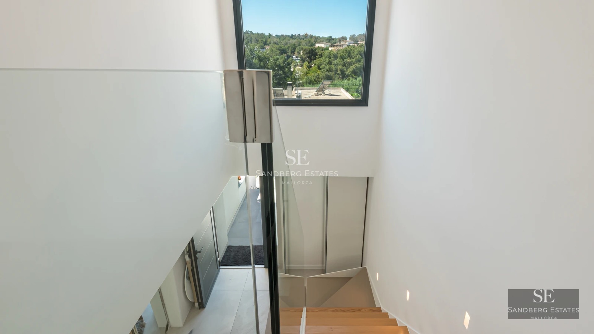 Exterior view of modern villa with infinity pool, lush garden, and spacious terraces. Minimalist architectural design with high-quality finishes.