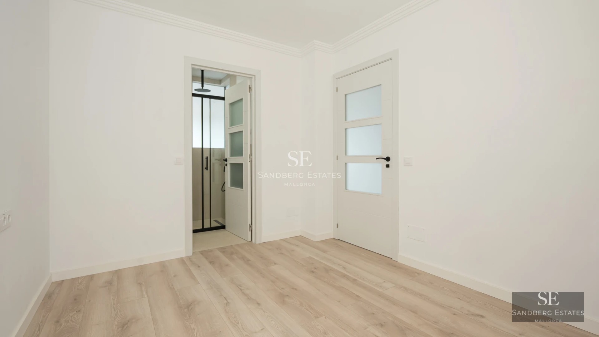 Exterior view of a modern villa featuring a pool, garden, and minimalist architectural design. Large windows reflecting natural light.