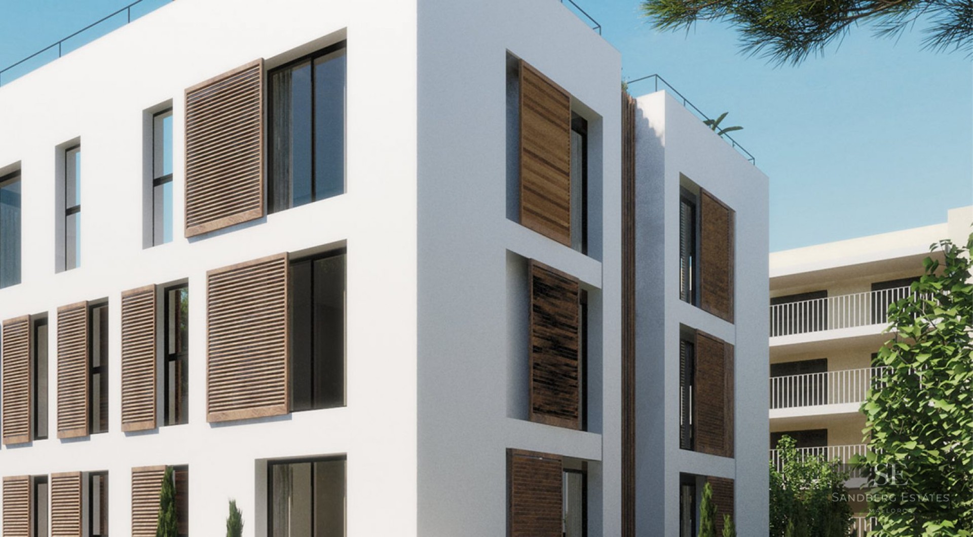 Modern white multi-story building featuring large windows with sliding wooden louvered shutters under a clear blue sky.