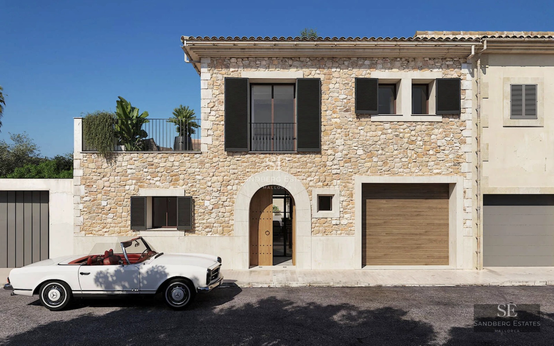 Bright living room with panoramic sea views. Modern interior featuring large windows, wooden floors, and minimalist decor.