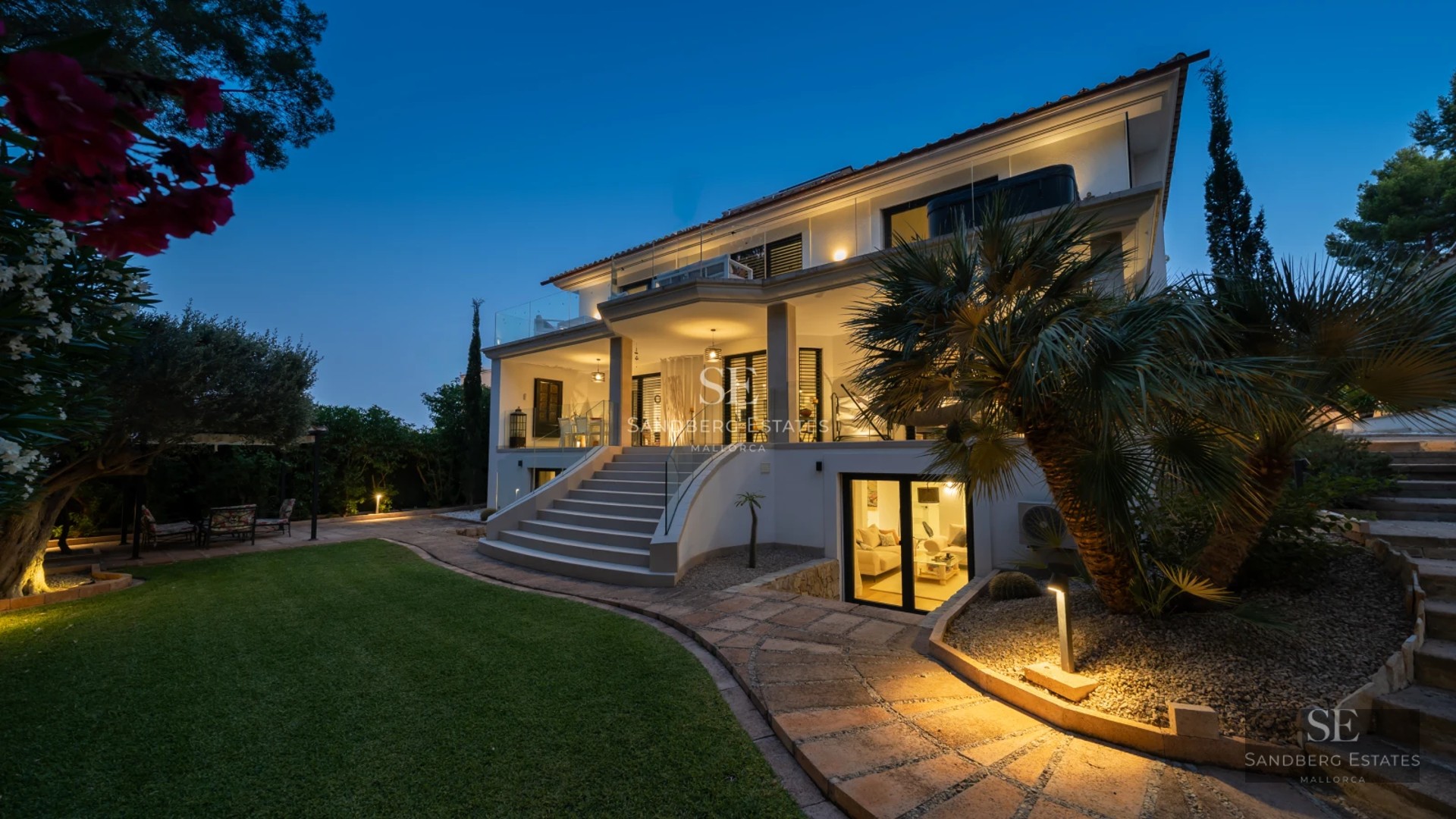 View of a modern villa with infinity pool and expansive outdoor spaces. Minimalist design featuring large windows and luxury finishes.