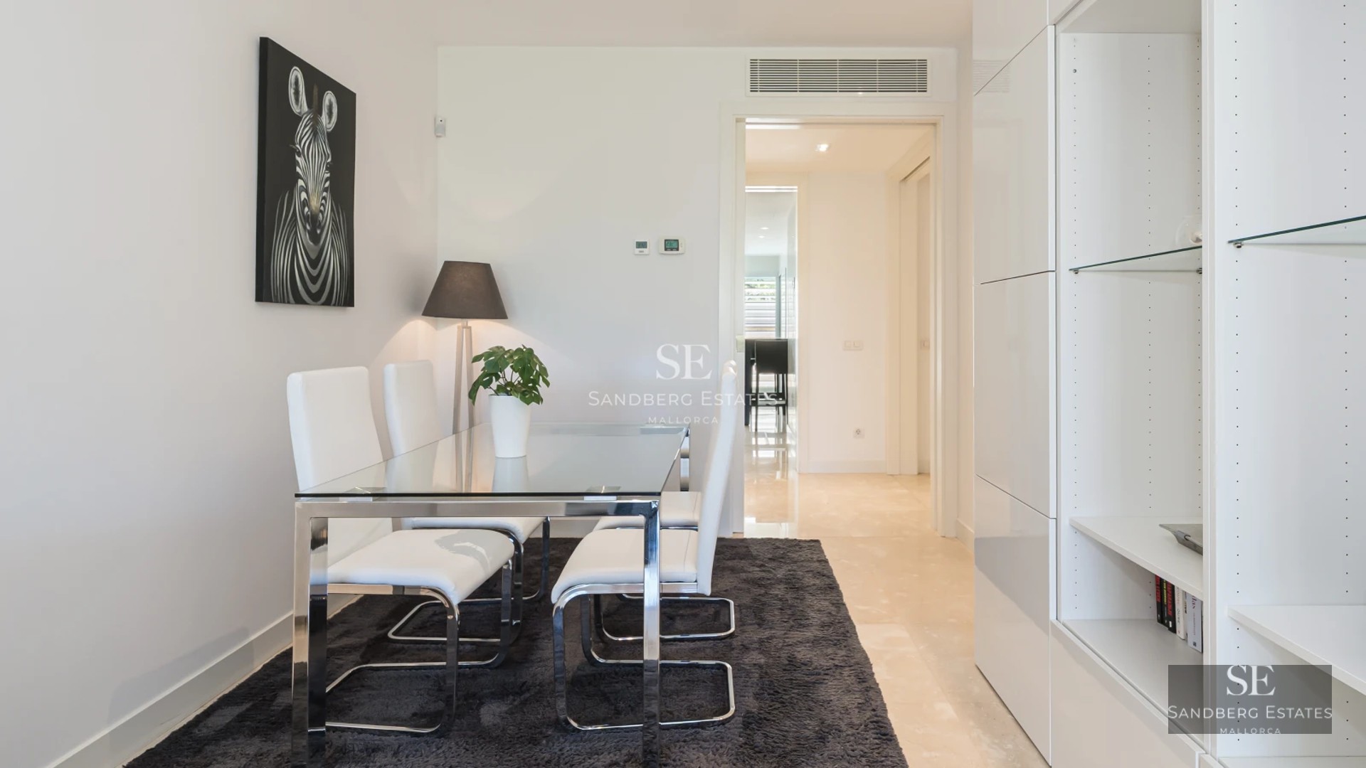 Expansive outdoor area with pool, seating area and lush greenery. Modern and relaxing design for enjoying the outdoors.