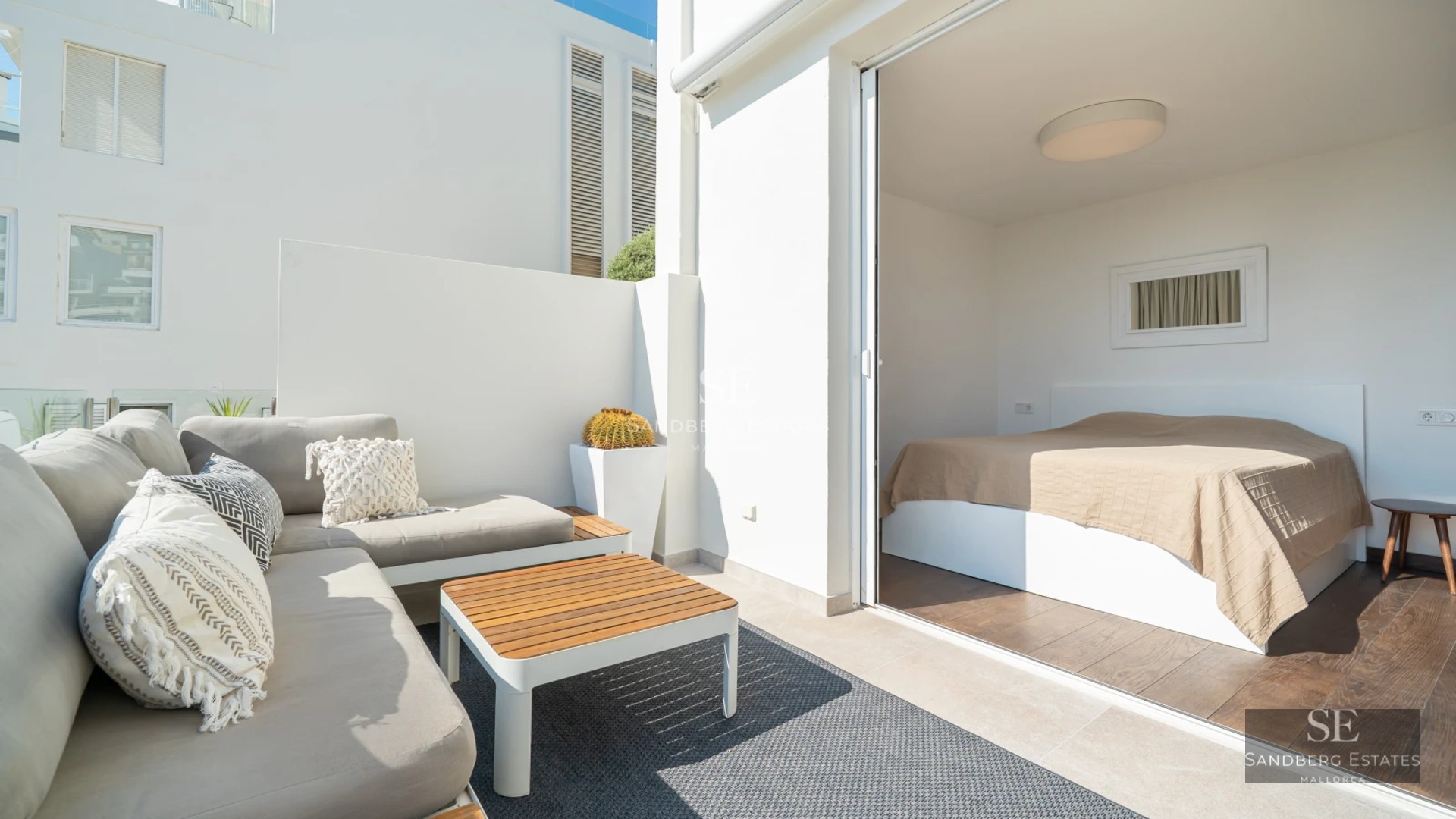 View of infinity pool with terrace and lush greenery. Modern architecture with large windows. Elegant exterior design.