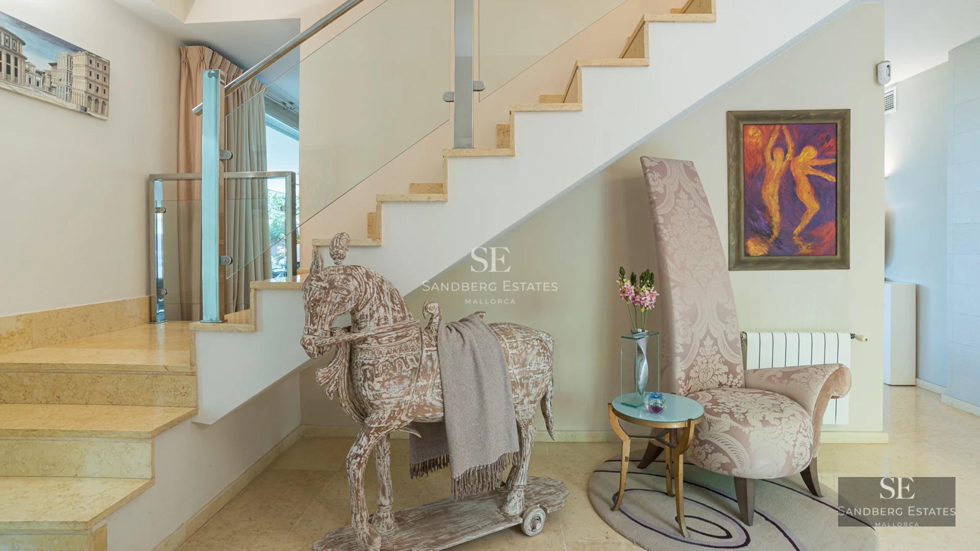 Bright, spacious living room with large windows, modern furniture, and stunning views. Light wood floors and minimalist details.