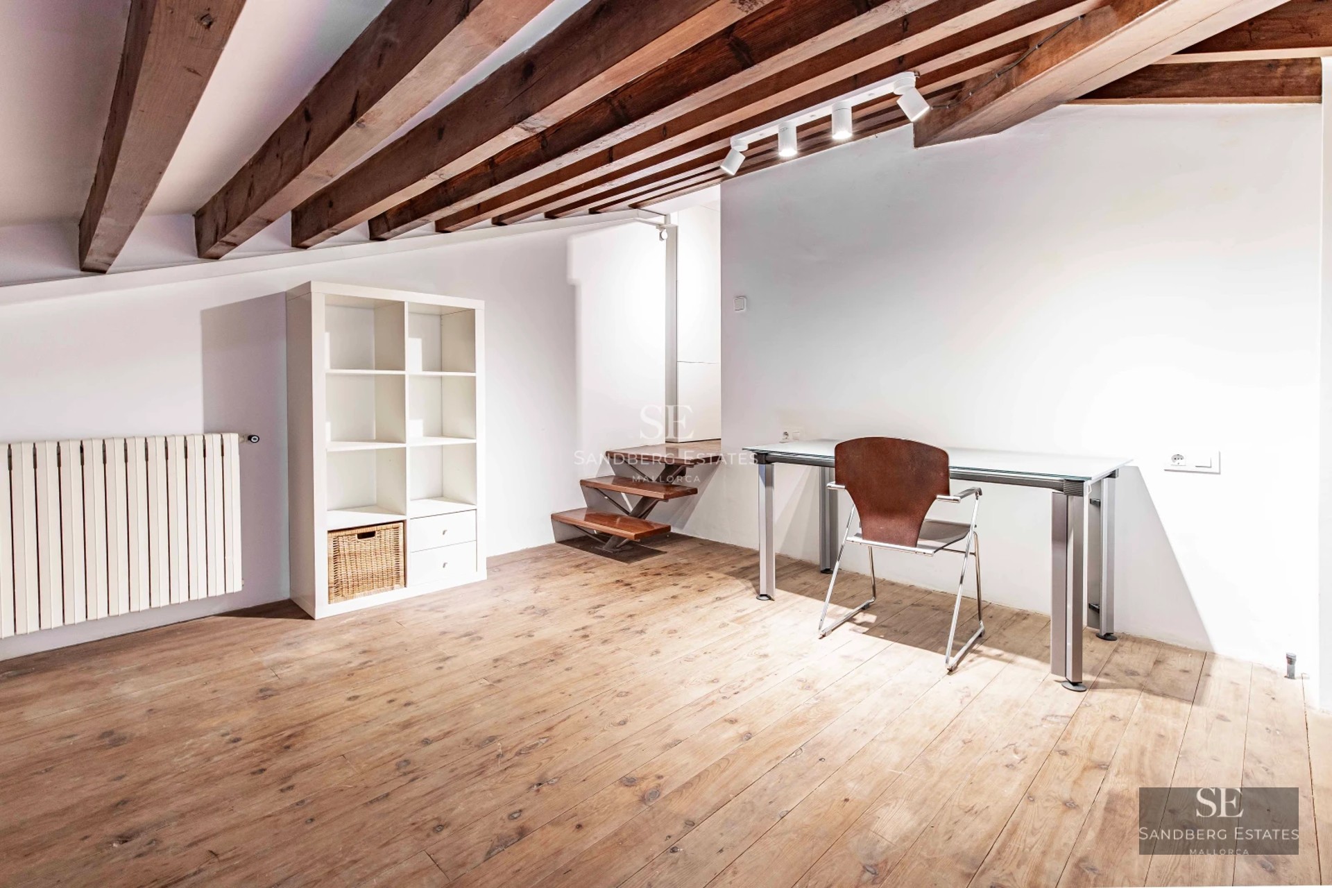 Aerial view of a modern villa featuring an infinity pool, landscaped garden, and expansive terraces. Sleek, minimalist architecture.