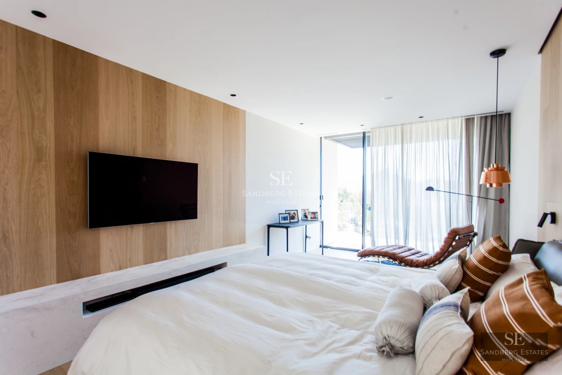 Exterior view of a modern house with pool. Minimalist architecture, large windows, and lush landscaping.