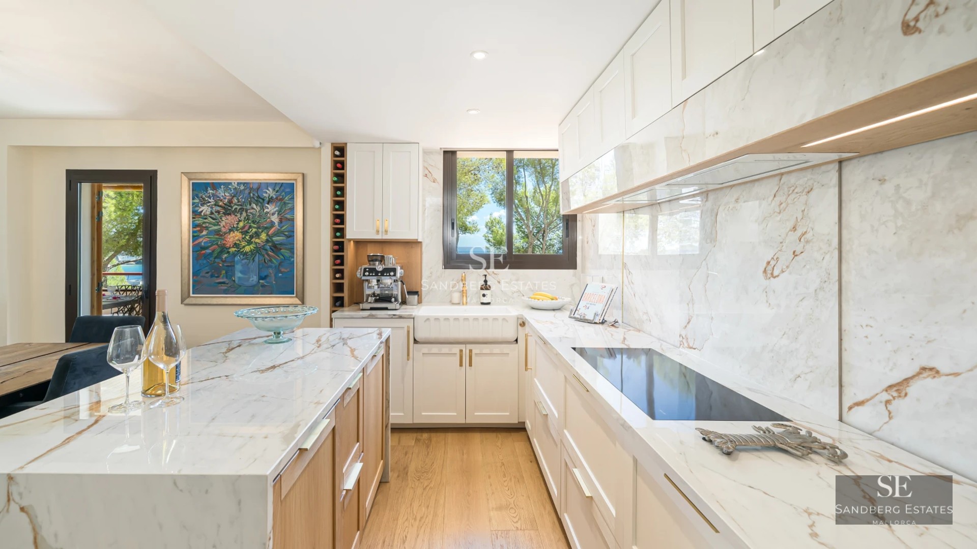 Spacious sea view terrace, modern furniture, infinity pool, and contemporary architectural design.